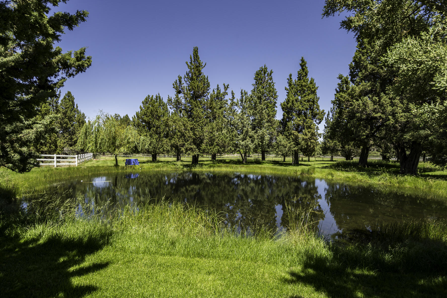 61445 Gosney Road Bend, OR 97702 - Photo 81 of 83 a view of a lake with a yard