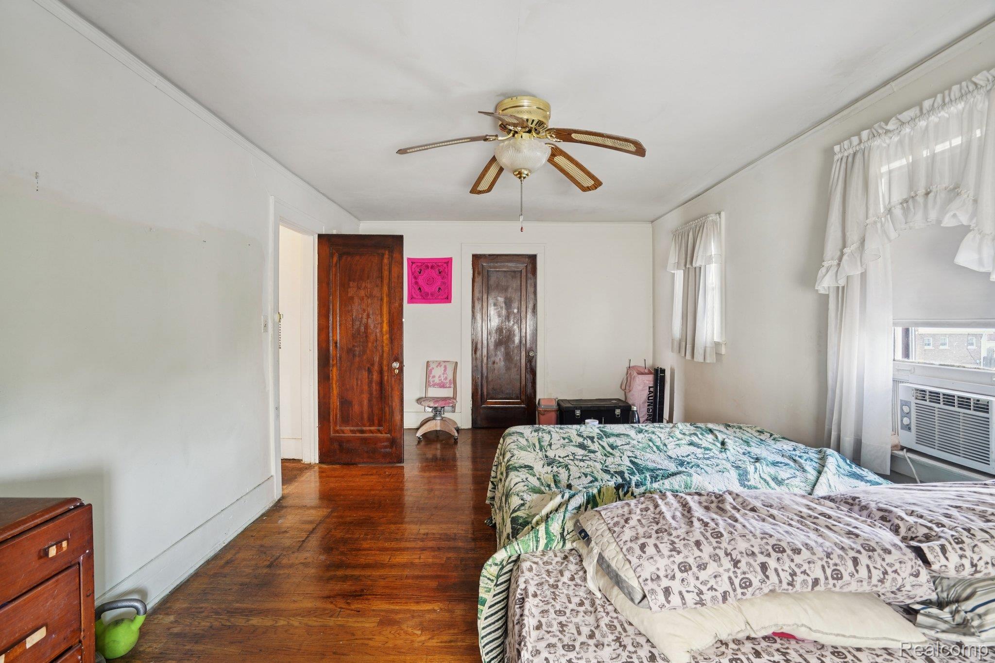 4101 Pasadena Street Detroit, MI 48238 - Photo 34 of 42 Hardwood flooring throughout, ceiling fan, and two paneled interior doors