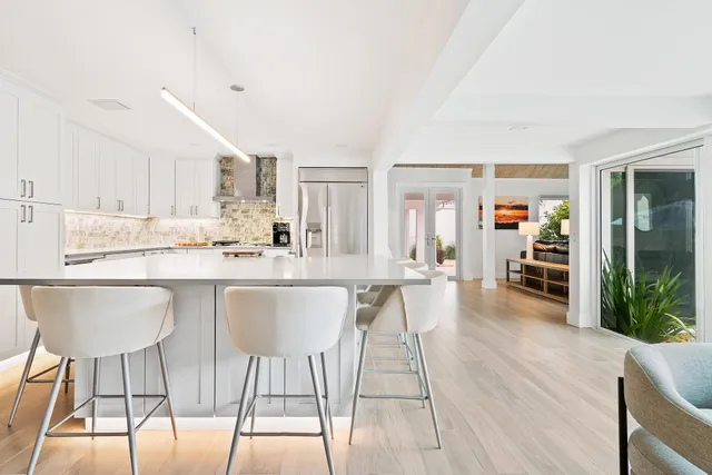 a kitchen with stainless steel appliances granite countertop a stove and a sink