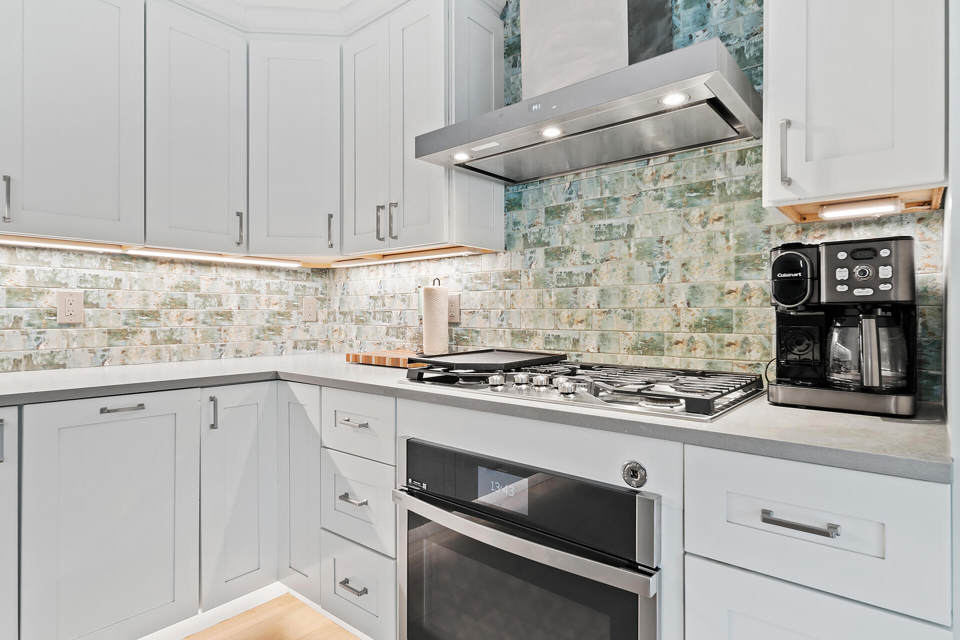 Undisclosed Address Jupiter, FL 33477 - Photo 14 of 107 a kitchen with stainless steel appliances granite countertop a stove and a sink
