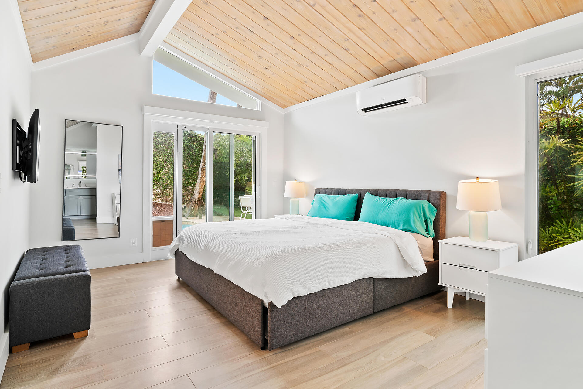 Undisclosed Address Jupiter, FL 33477 - Photo 16 of 107 a large bed sitting in a bedroom next to a window