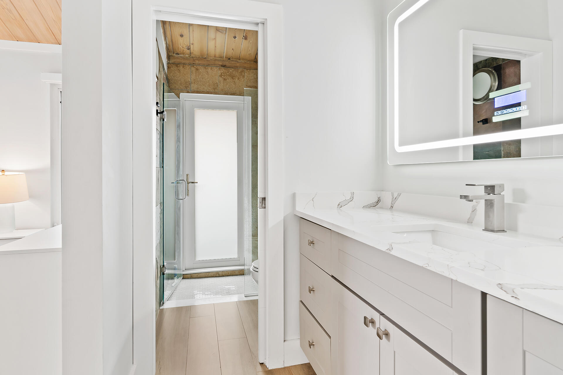 Undisclosed Address Jupiter, FL 33477 - Photo 20 of 107 a bathroom with a sink and a mirror