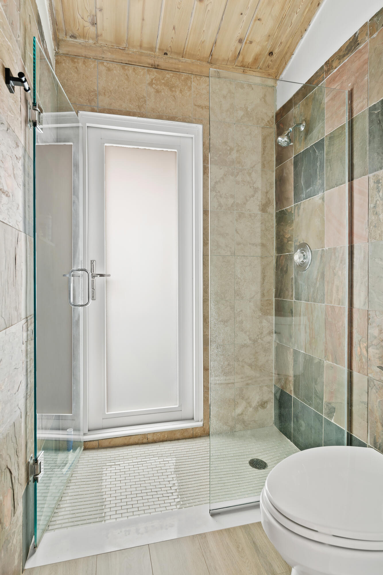 Undisclosed Address Jupiter, FL 33477 - Photo 21 of 107 a bathroom with a shower a toilet and a shower