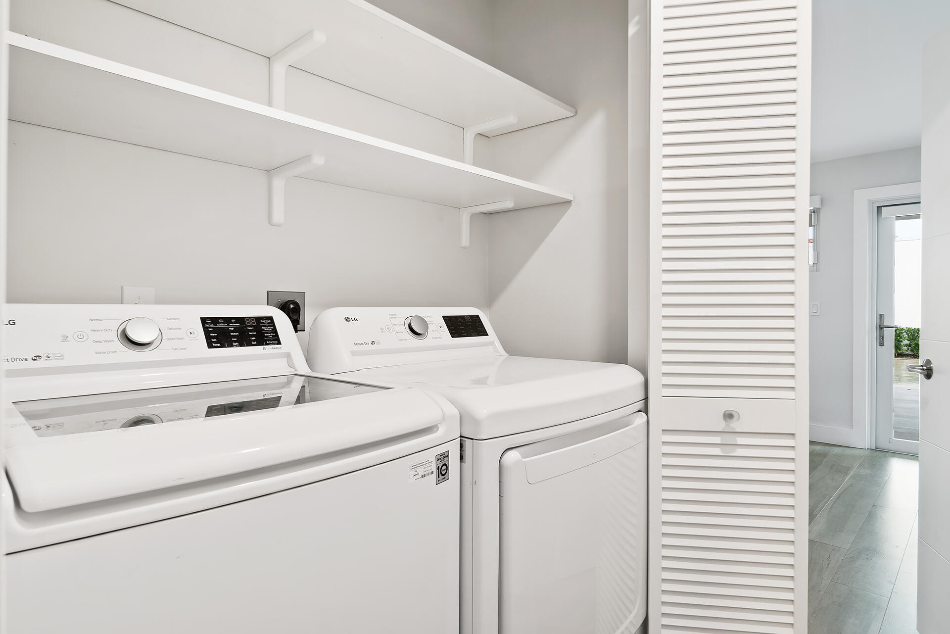 Undisclosed Address Jupiter, FL 33477 - Photo 23 of 107 a utility room with dryer and washer