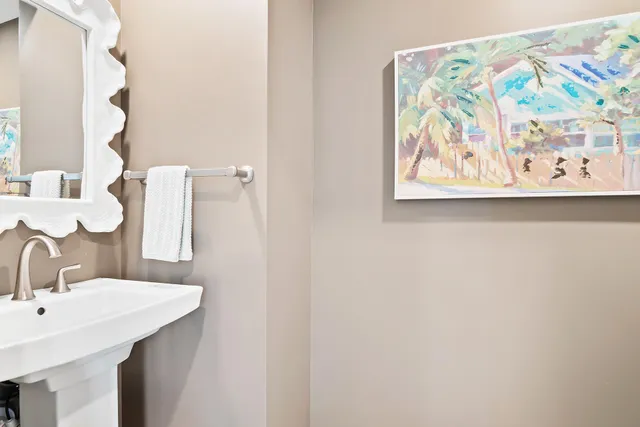 a bathroom with a double vanity sink a toilet and a tub