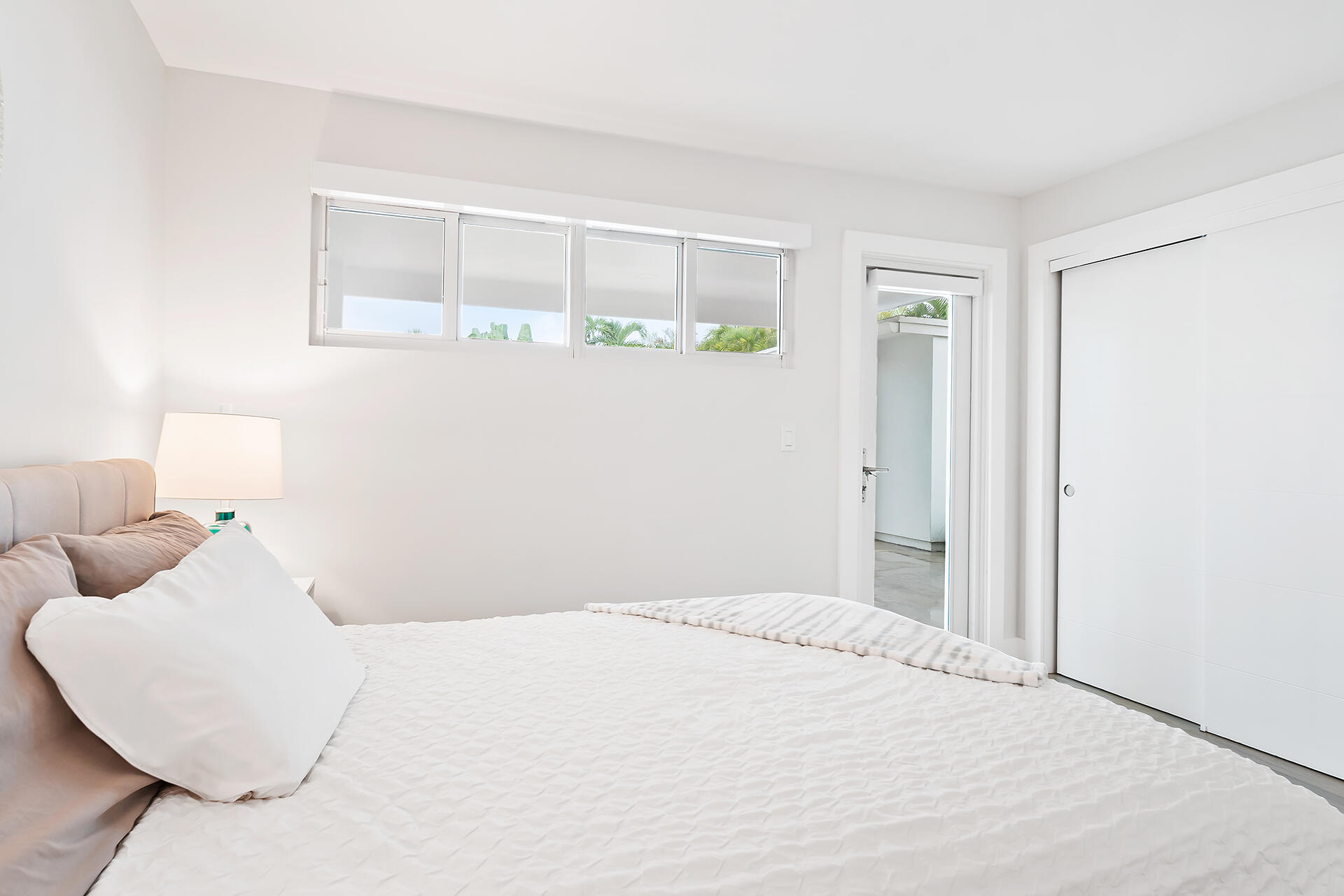 Undisclosed Address Jupiter, FL 33477 - Photo 29 of 107 a bedroom with a bed and a window