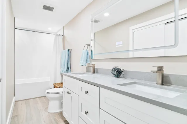 a view of a patio with table and chairs and potted plants