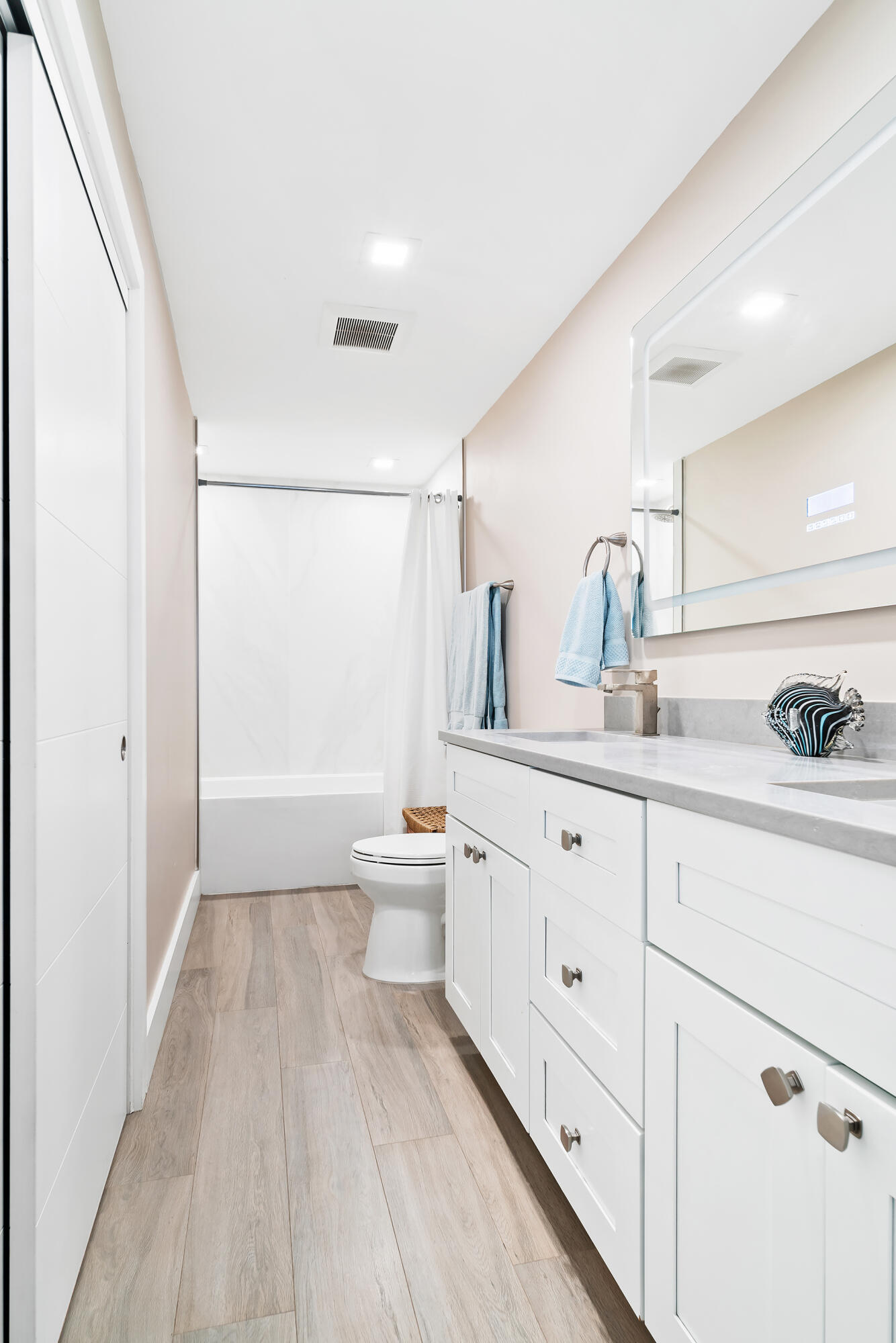 Undisclosed Address Jupiter, FL 33477 - Photo 31 of 107 a spacious bathroom with a double vanity sink a mirror and a shower