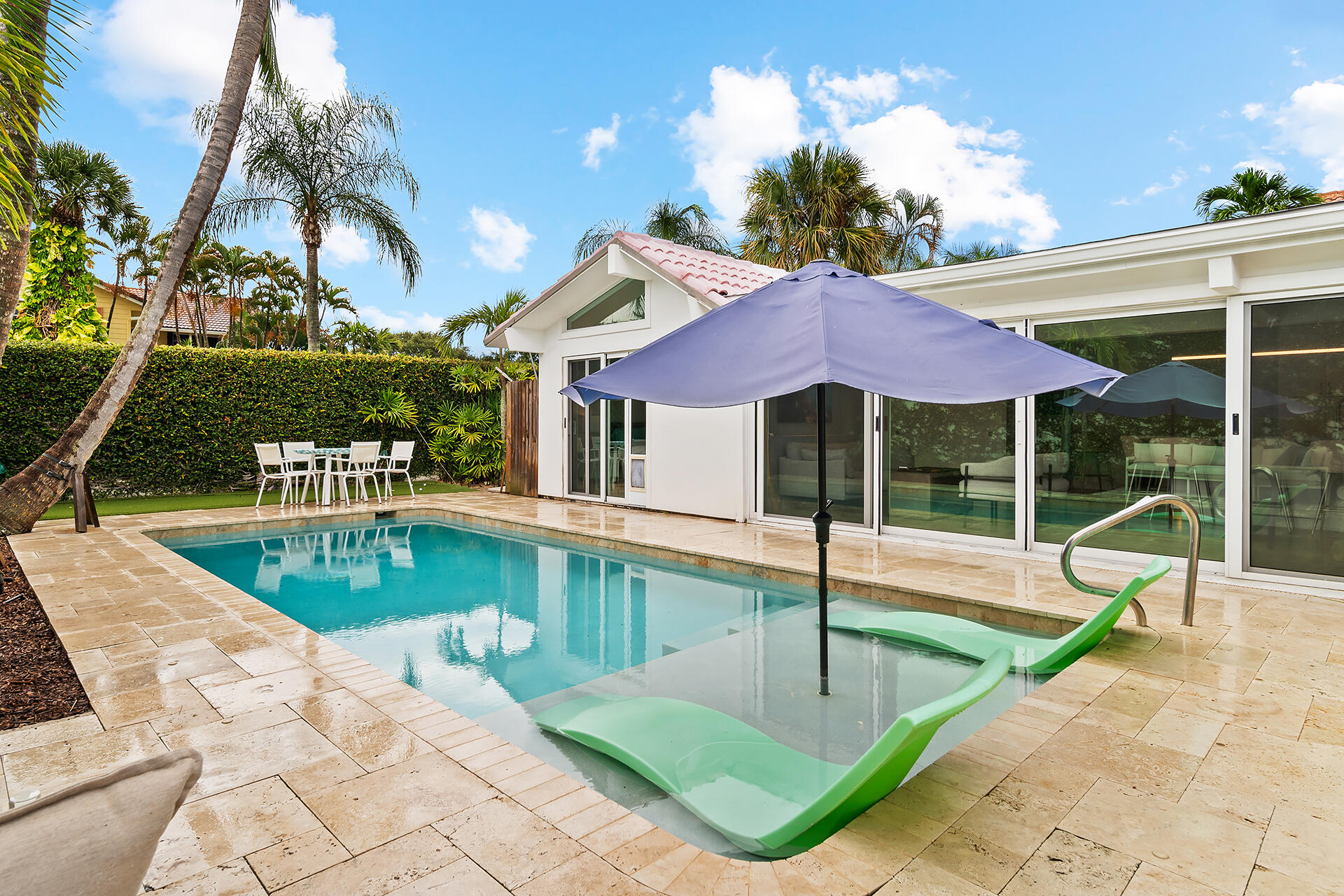Undisclosed Address Jupiter, FL 33477 - Photo 35 of 107 a view of a house with swimming pool