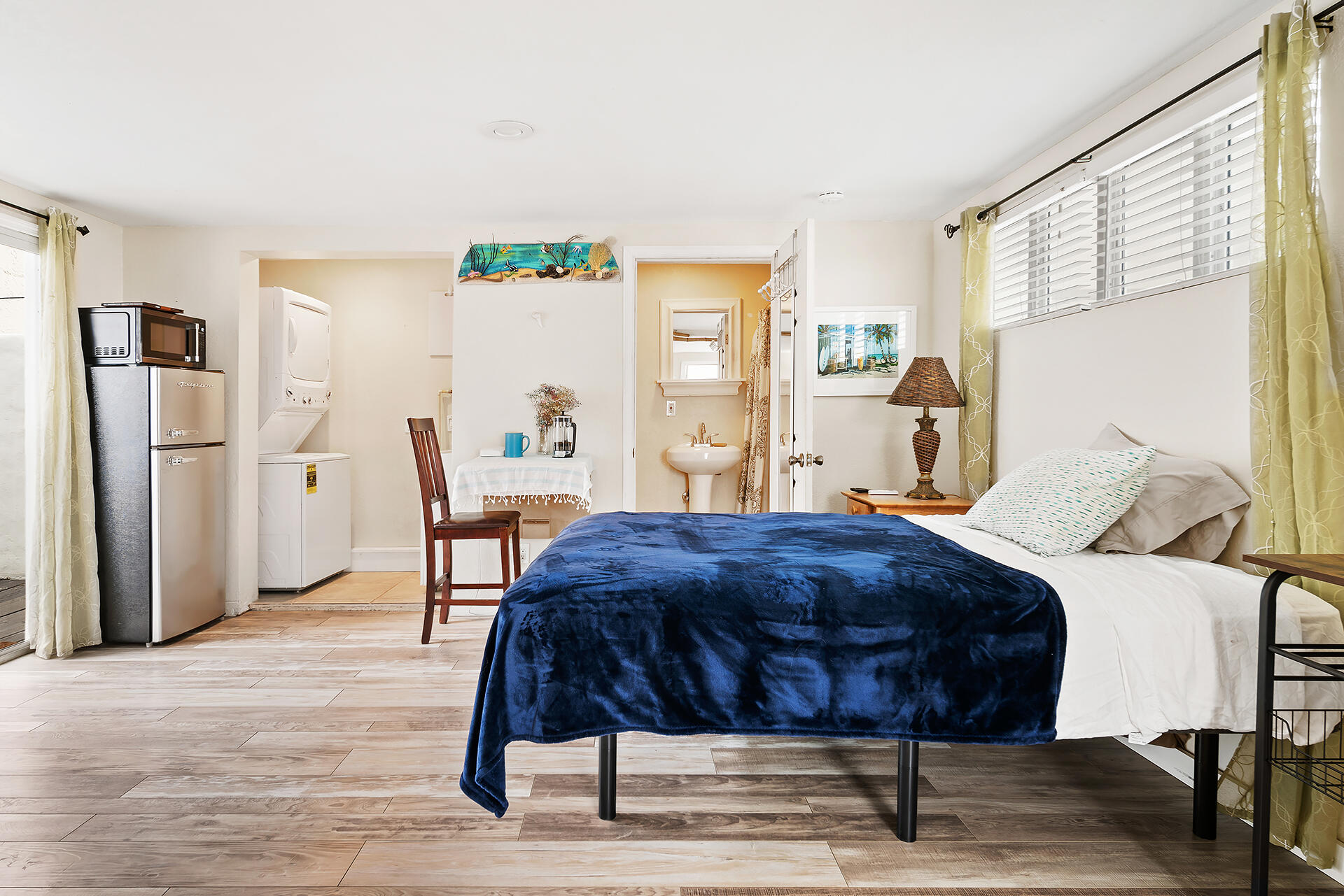 Undisclosed Address Jupiter, FL 33477 - Photo 46 of 107 a bedroom with a bed and a table in it