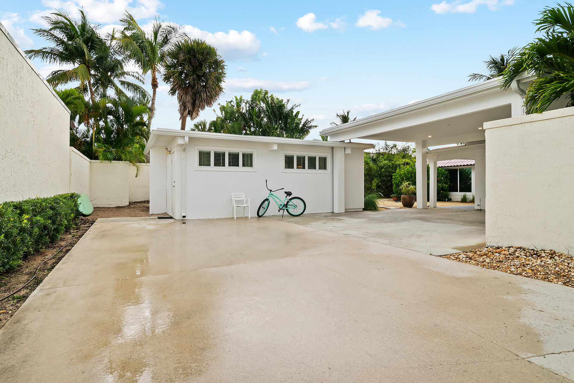 Undisclosed Address Jupiter, FL 33477 - Photo 47 of 107 a view of a house with a outdoor space and palm trees
