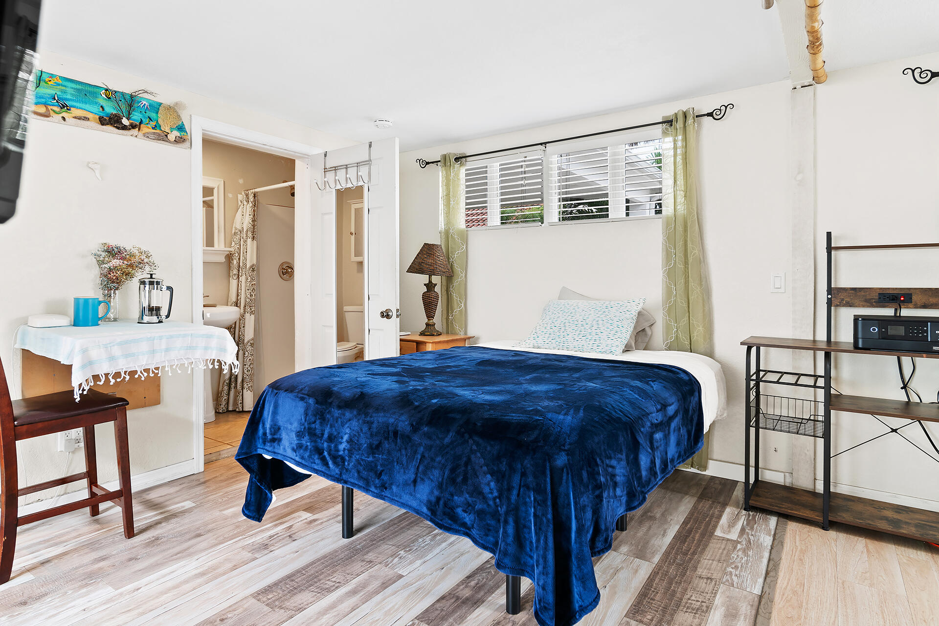 Undisclosed Address Jupiter, FL 33477 - Photo 48 of 107 a bedroom with a bed and a table