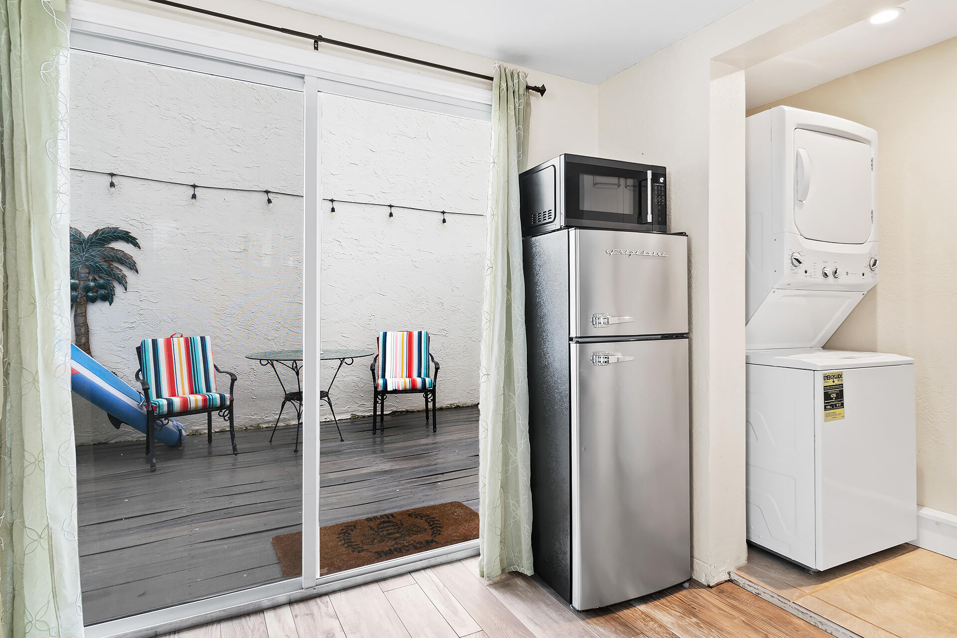 Undisclosed Address Jupiter, FL 33477 - Photo 51 of 107 a kitchen with stainless steel appliances granite countertop a refrigerator and a view of living room