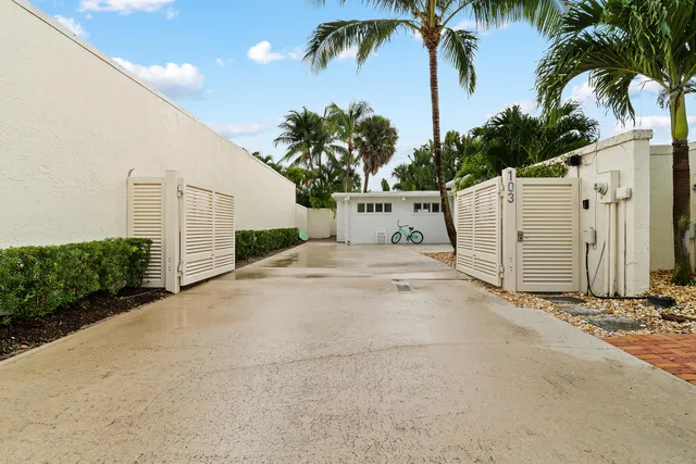 a living room with dining room and wooden floor