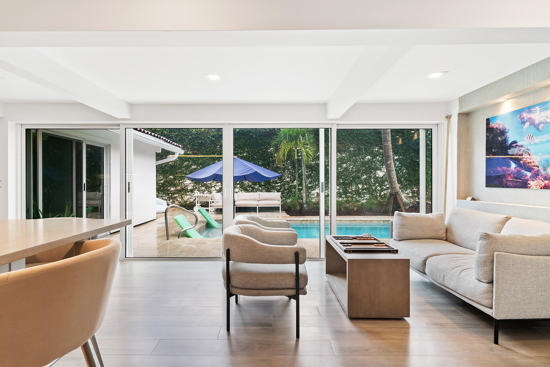 Undisclosed Address Jupiter, FL 33477 - Photo 6 of 107 a living room with furniture and a large window