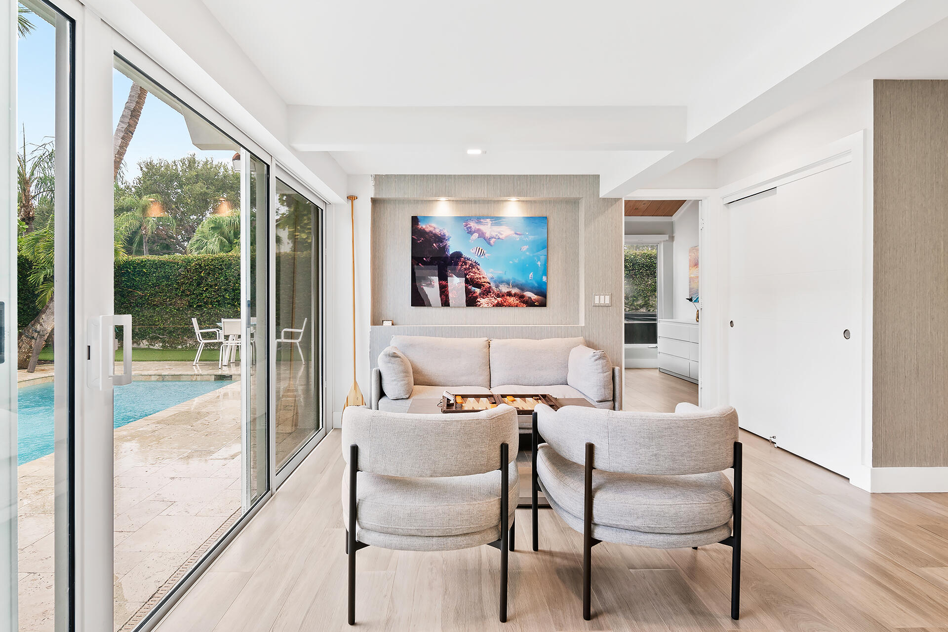 Undisclosed Address Jupiter, FL 33477 - Photo 7 of 107 a dining room with furniture a rug and a floor to ceiling window