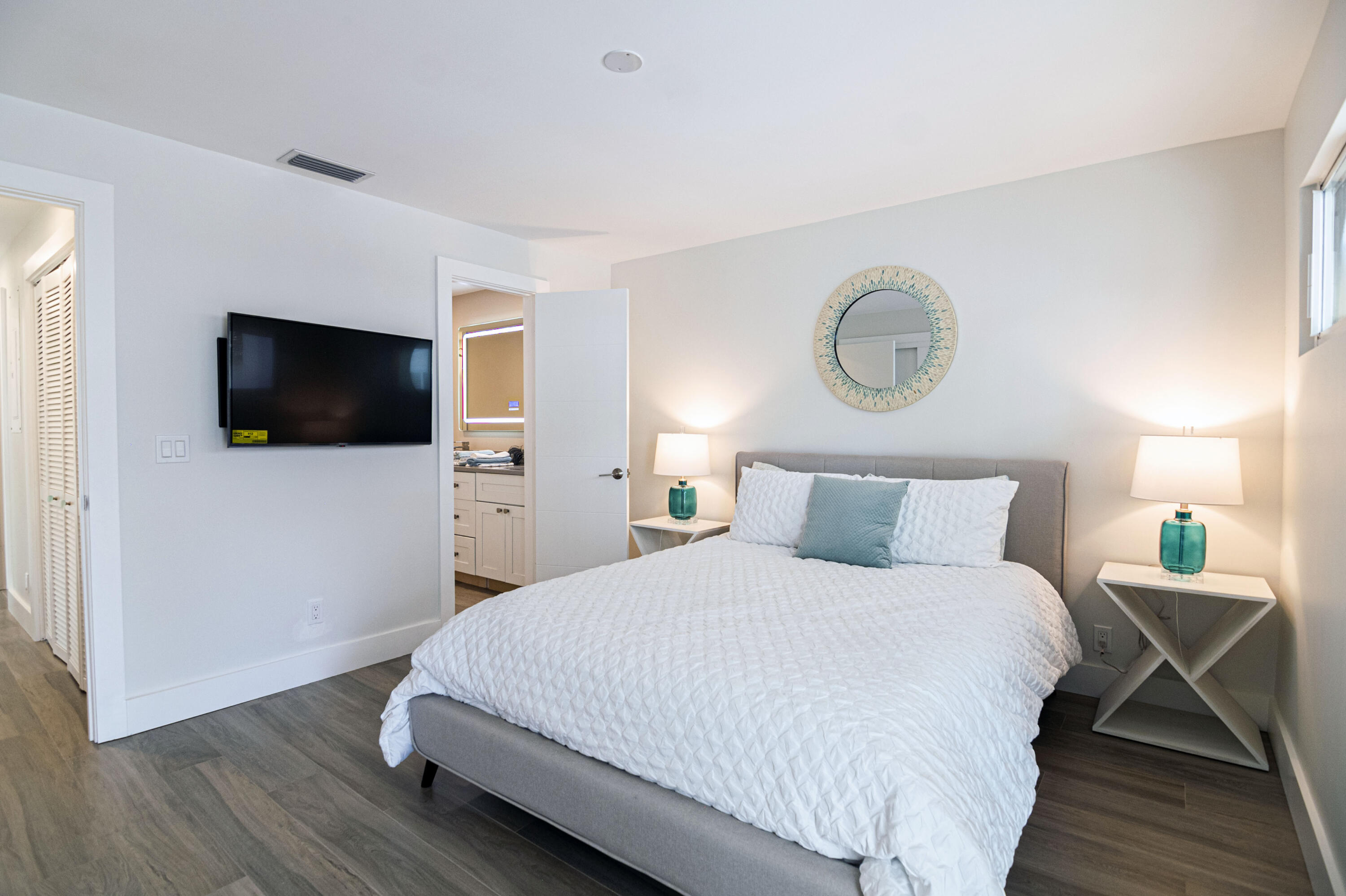 Undisclosed Address Jupiter, FL 33477 - Photo 71 of 107 a bedroom with a bed and a flat screen tv