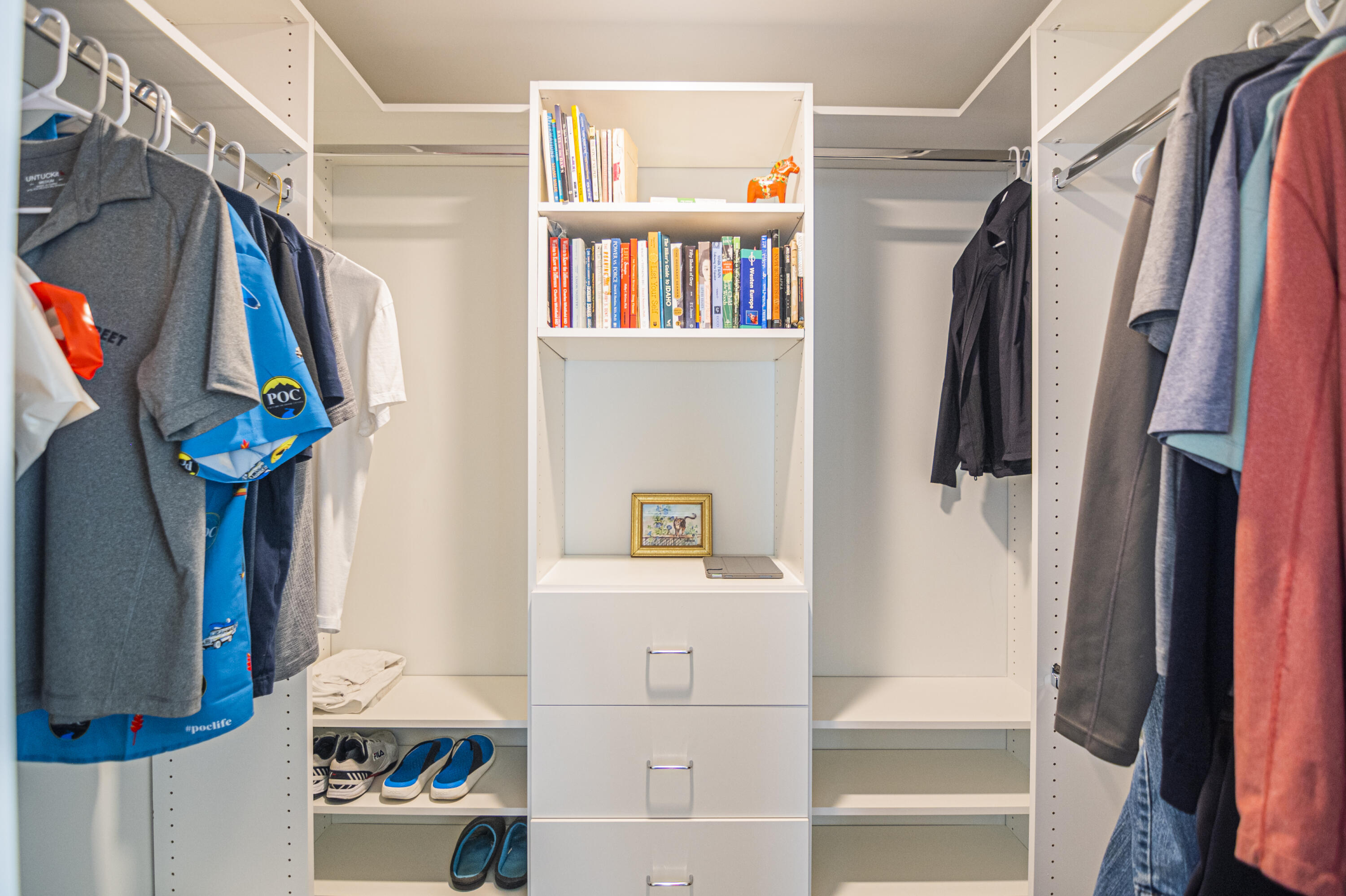 Undisclosed Address Jupiter, FL 33477 - Photo 74 of 107 a view of walk in closet with clothes and shoes