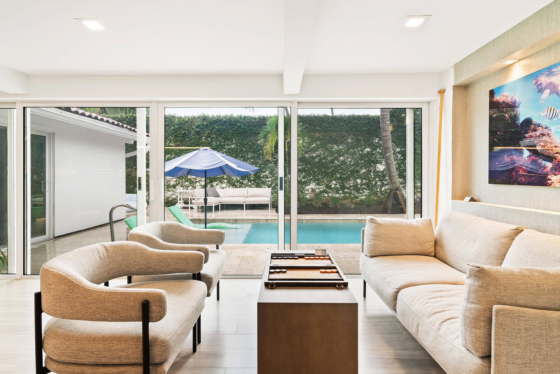 Undisclosed Address Jupiter, FL 33477 - Photo 8 of 107 a living room with furniture and a large window