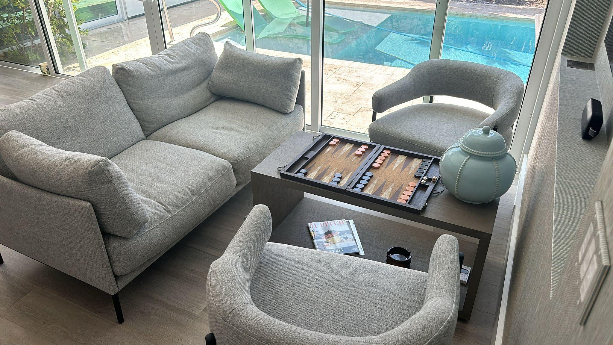 Undisclosed Address Jupiter, FL 33477 - Photo 82 of 107 a living room with furniture and a window