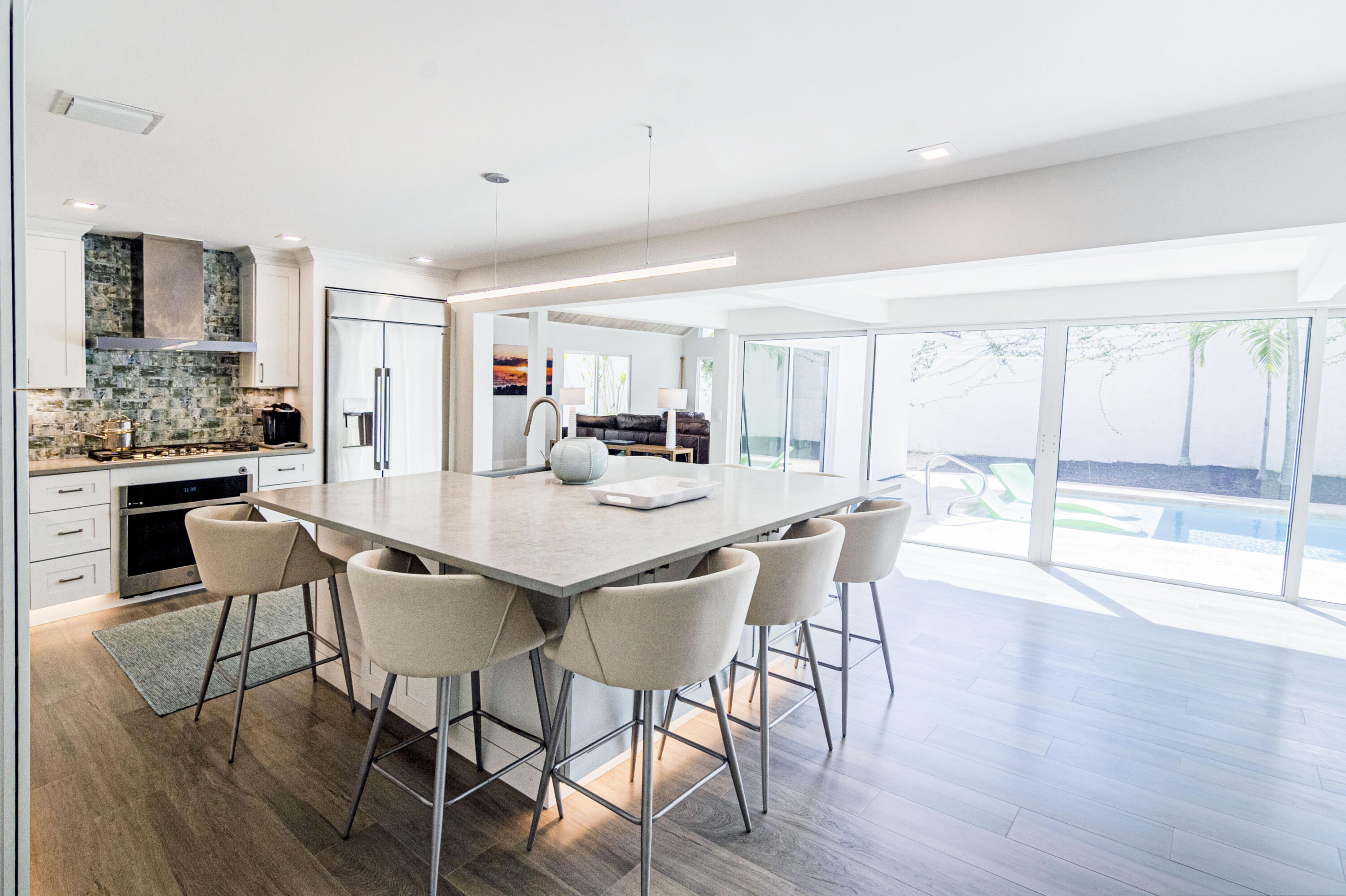 Undisclosed Address Jupiter, FL 33477 - Photo 84 of 107 a dining room with furniture and wooden floor