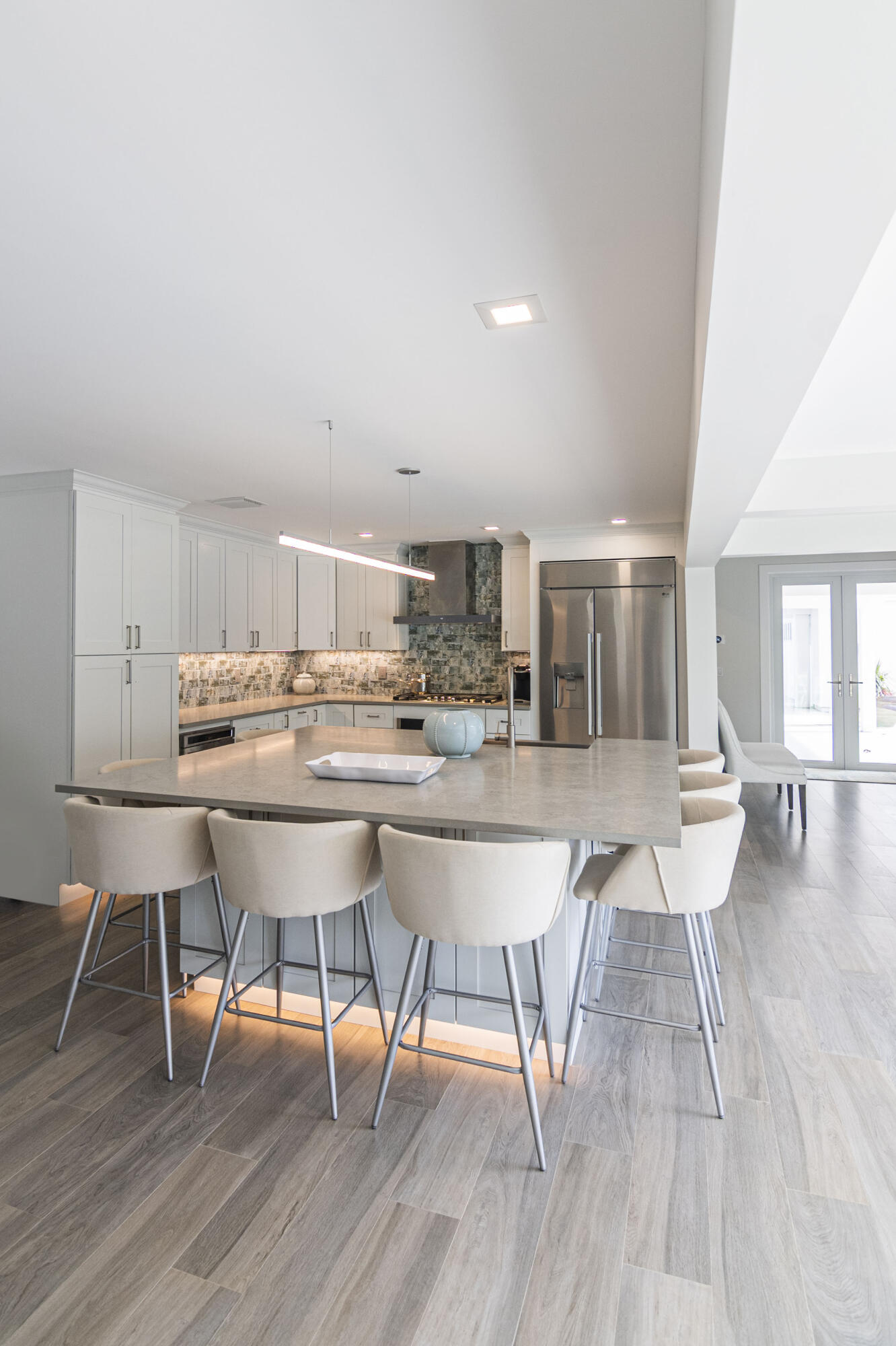 Undisclosed Address Jupiter, FL 33477 - Photo 87 of 107 a living room with dining room and wooden floor