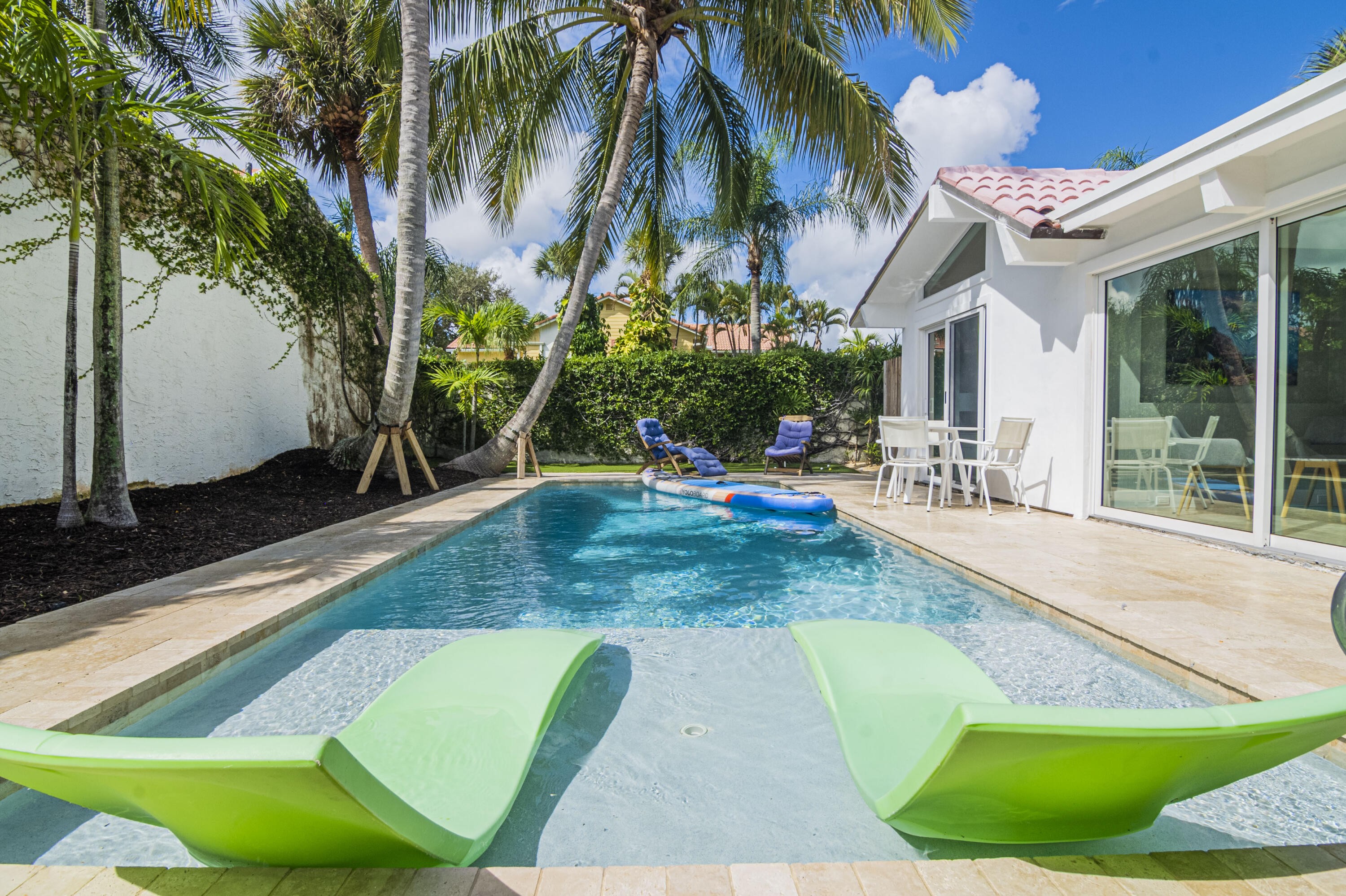 Undisclosed Address Jupiter, FL 33477 - Photo 91 of 107 a view of a backyard with a patio