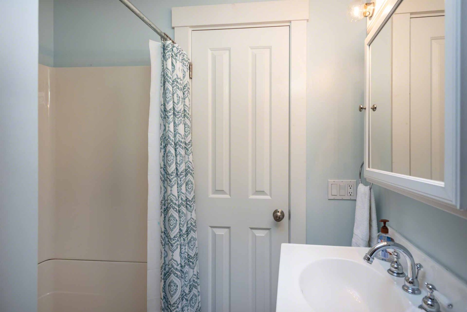 12 Zoll Road Edgartown, MA 02539 - Photo 22 of 29 a bathroom with a shower curtain and a sink