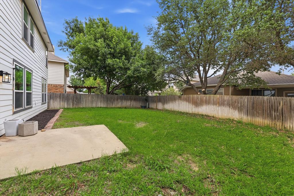 13236 Ridgepointe Road Fort Worth, TX 76244 - Photo 18 of 19 a view of a yard with a small cabin
