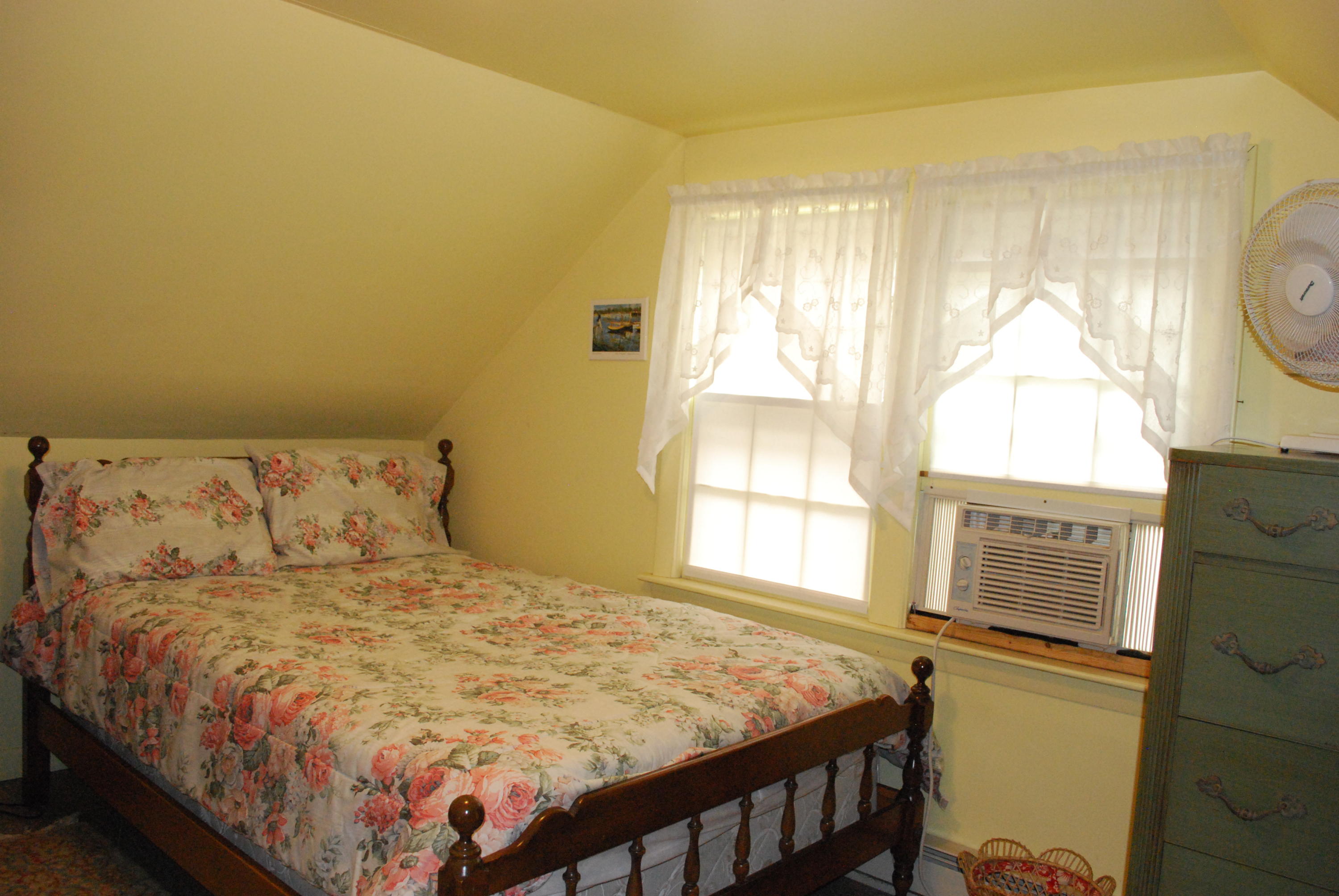 29 Cordwood Road Mashpee, MA 02649 - Photo 12 of 20 a bed sitting in a bedroom next to a window