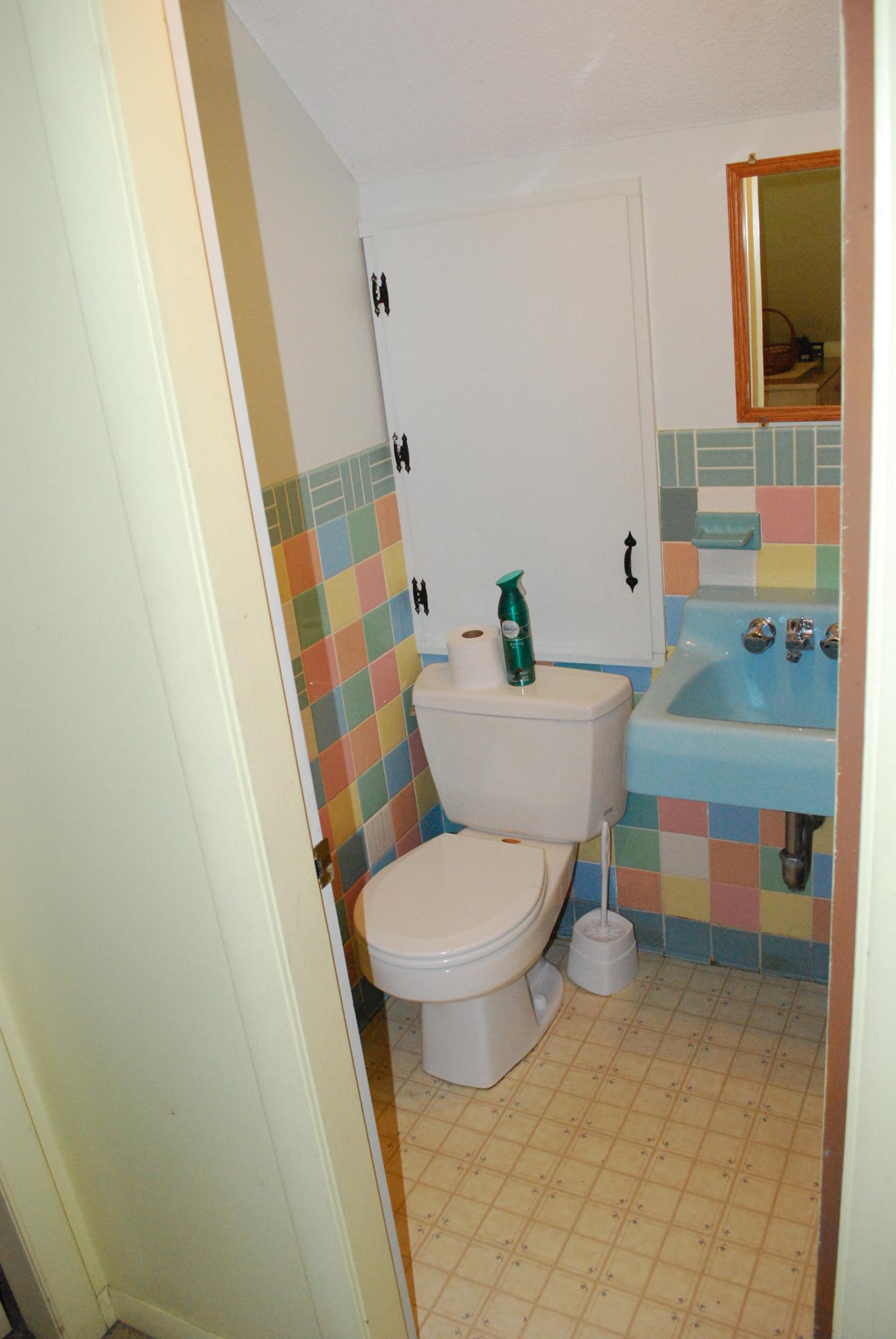 29 Cordwood Road Mashpee, MA 02649 - Photo 14 of 20 a white toilet sitting next to a bathroom sink and vanity