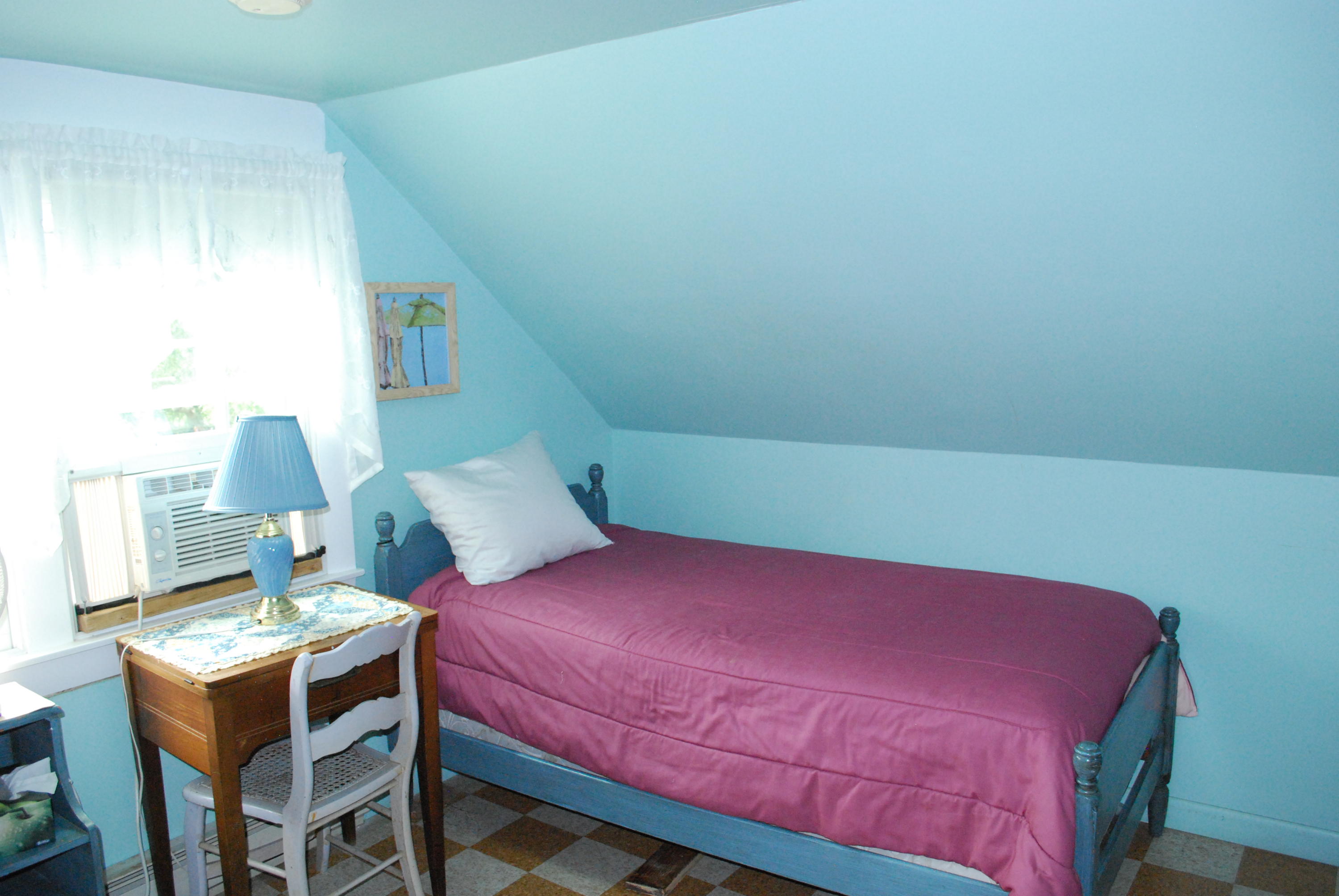 29 Cordwood Road Mashpee, MA 02649 - Photo 17 of 20 a bedroom with a bed and a table in it