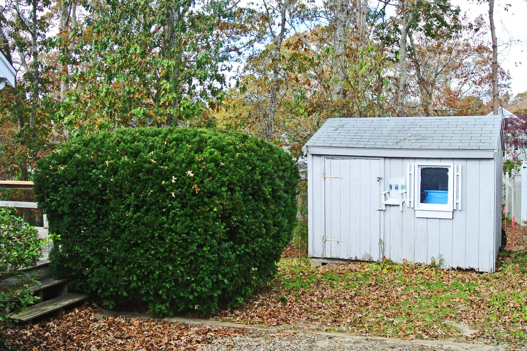 29 Cordwood Road Mashpee, MA 02649 - Photo 20 of 20 a house with trees in front of it