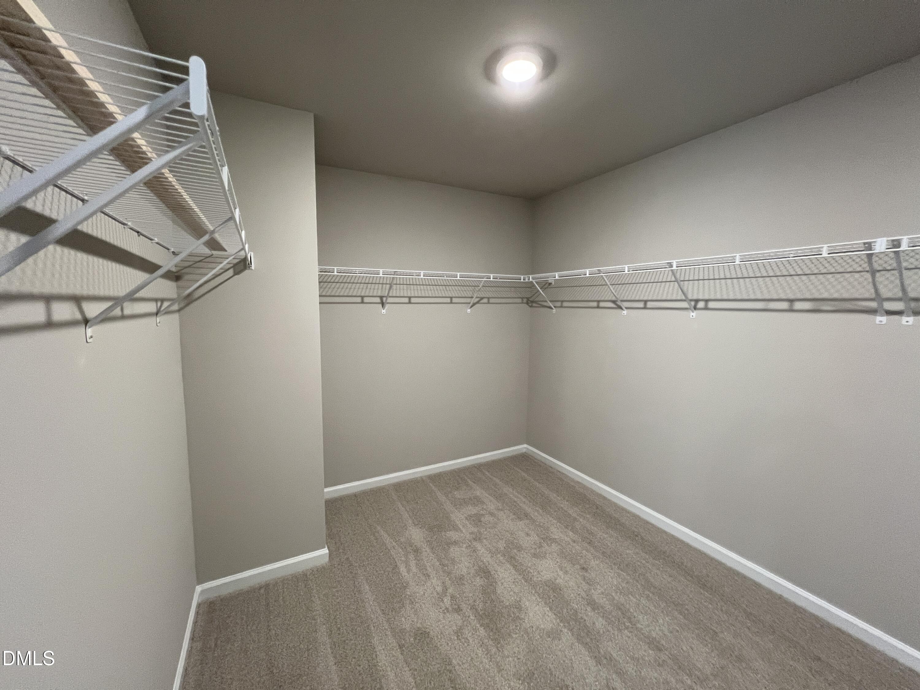 4036 Wesley Chapel Way Raleigh, NC 27616 - Photo 12 of 45 a view of a room with racks on the wall