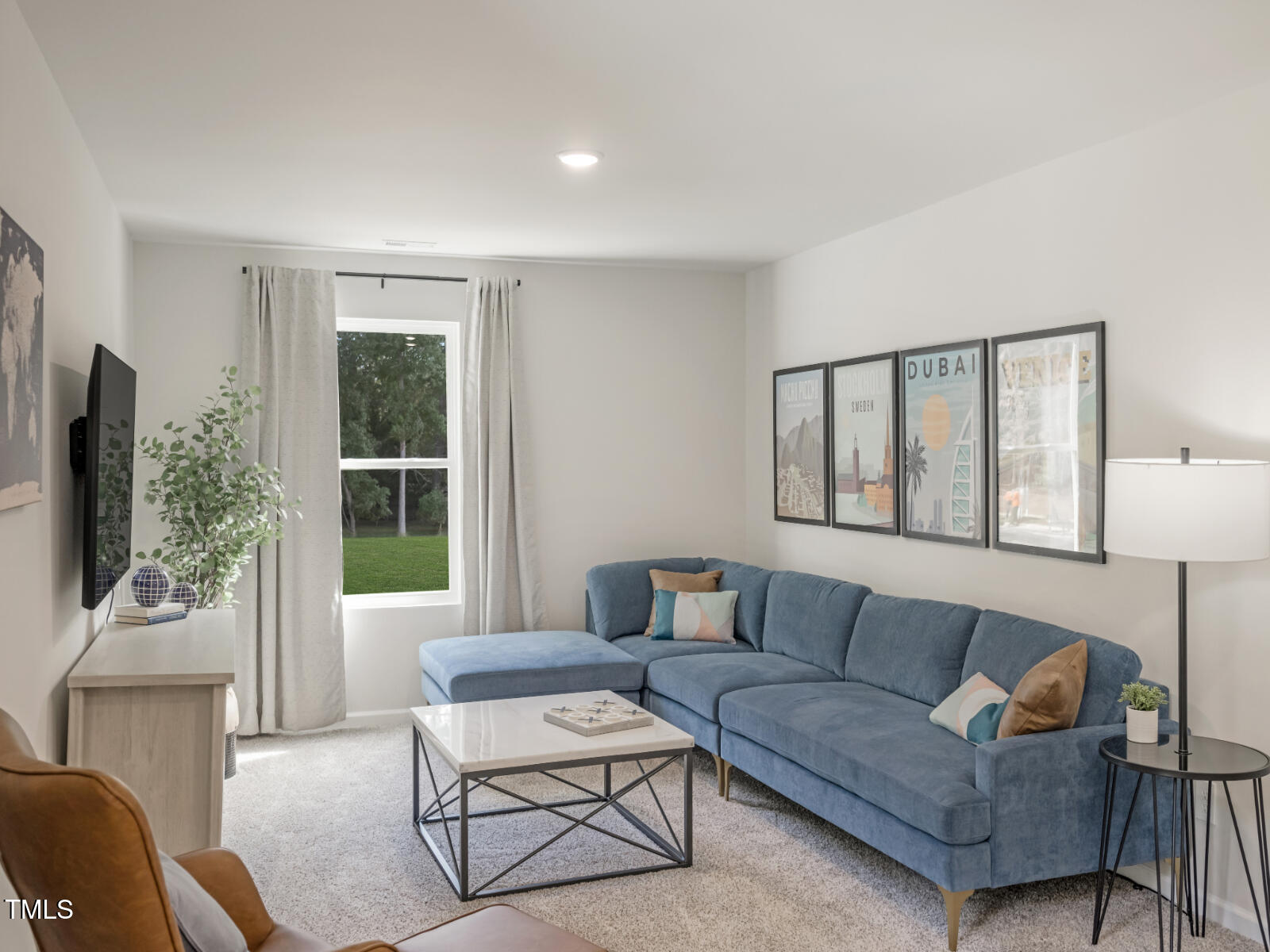4036 Wesley Chapel Way Raleigh, NC 27616 - Photo 35 of 45 a living room with furniture and a flat screen tv