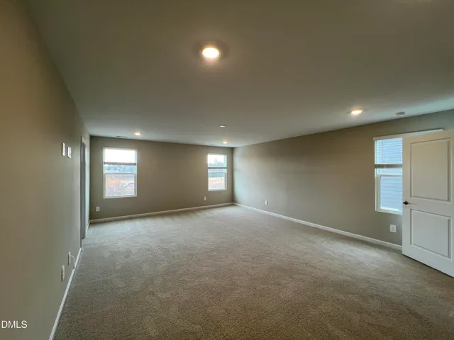 a view of a kitchen with wooden floor