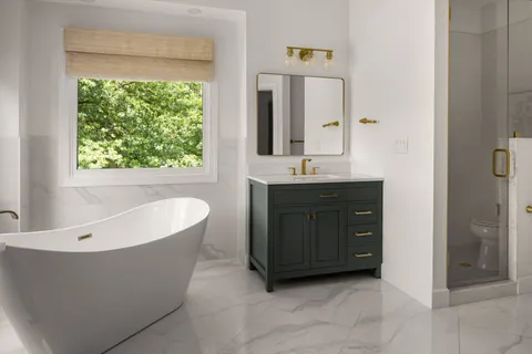 a spacious bathroom with a tub sink and mirror
