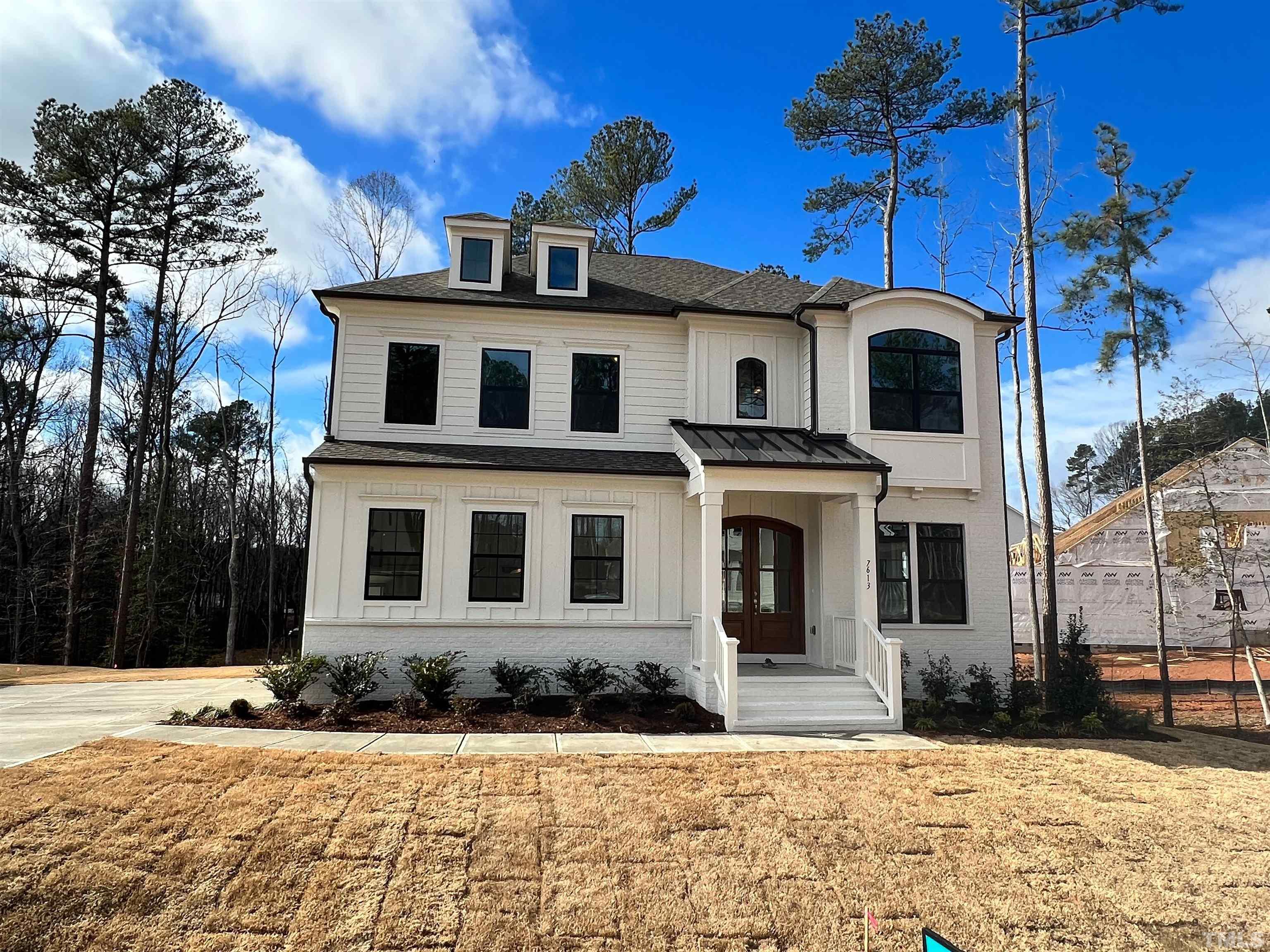7613 Hasentree Way Wake Forest, NC 27587 - Photo 1 of 39 a front view of a house with a yard