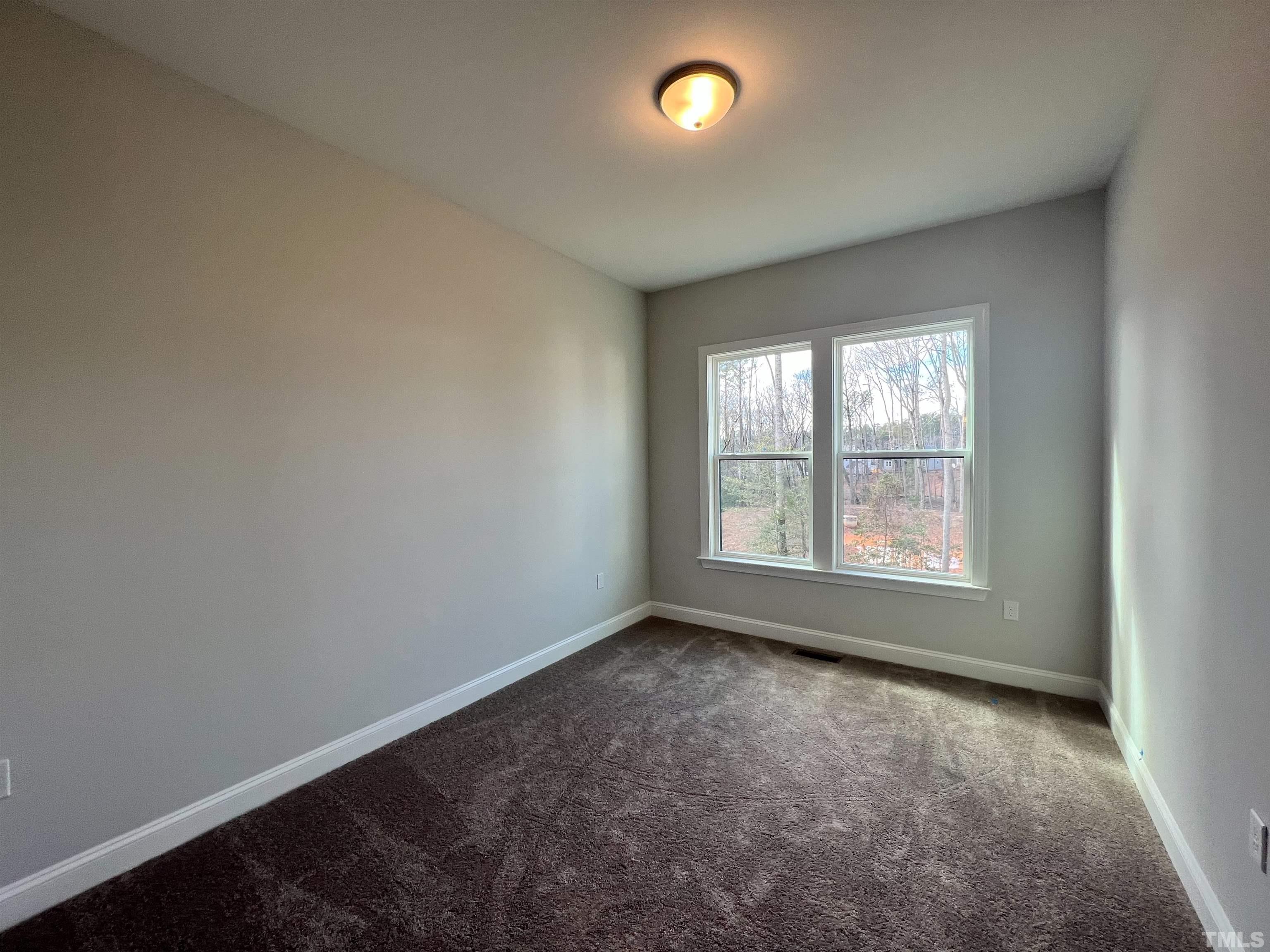 7613 Hasentree Way Wake Forest, NC 27587 - Photo 17 of 39 an empty room with a window