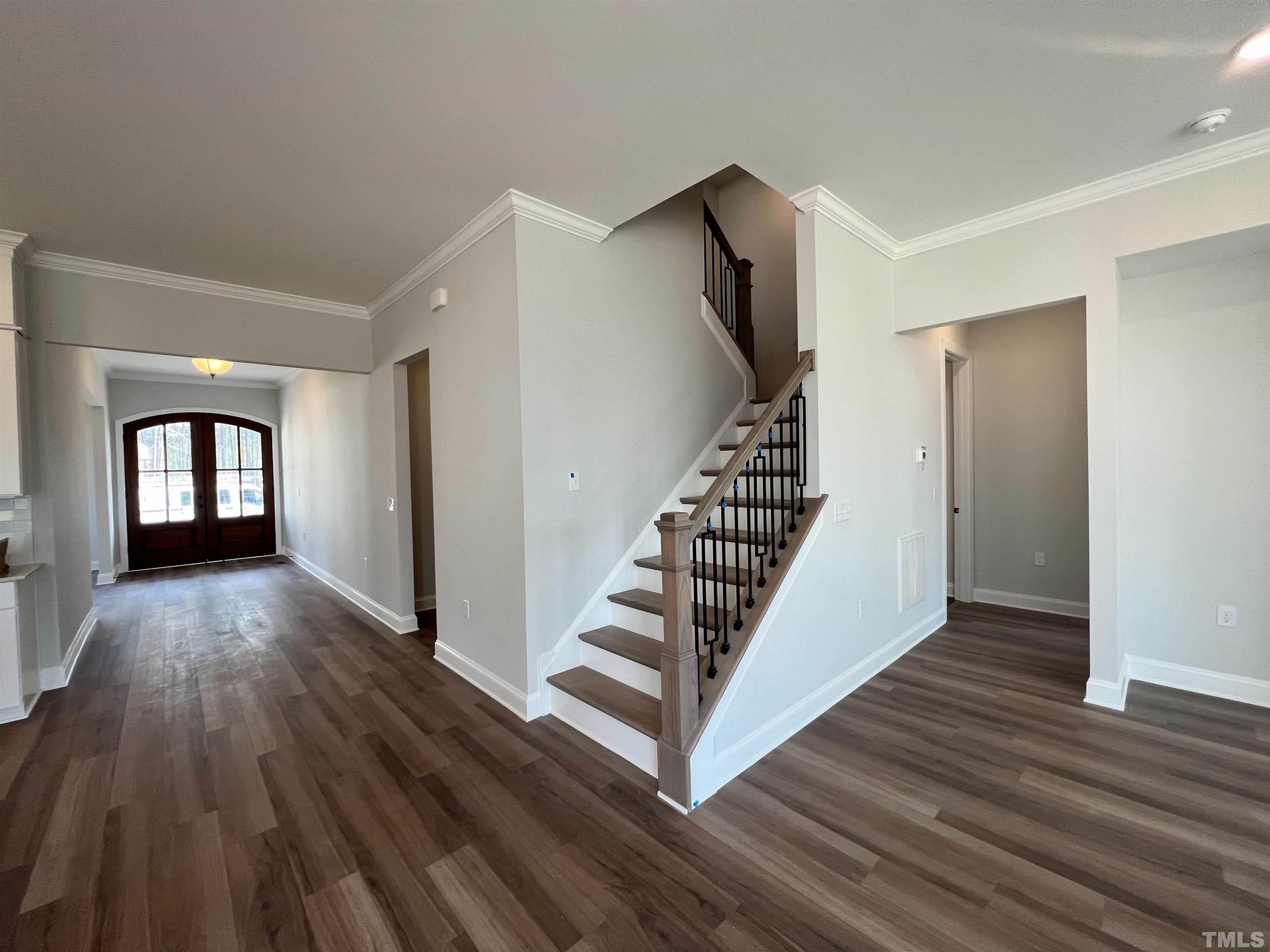 7613 Hasentree Way Wake Forest, NC 27587 - Photo 18 of 39 a view of entryway with wooden floor