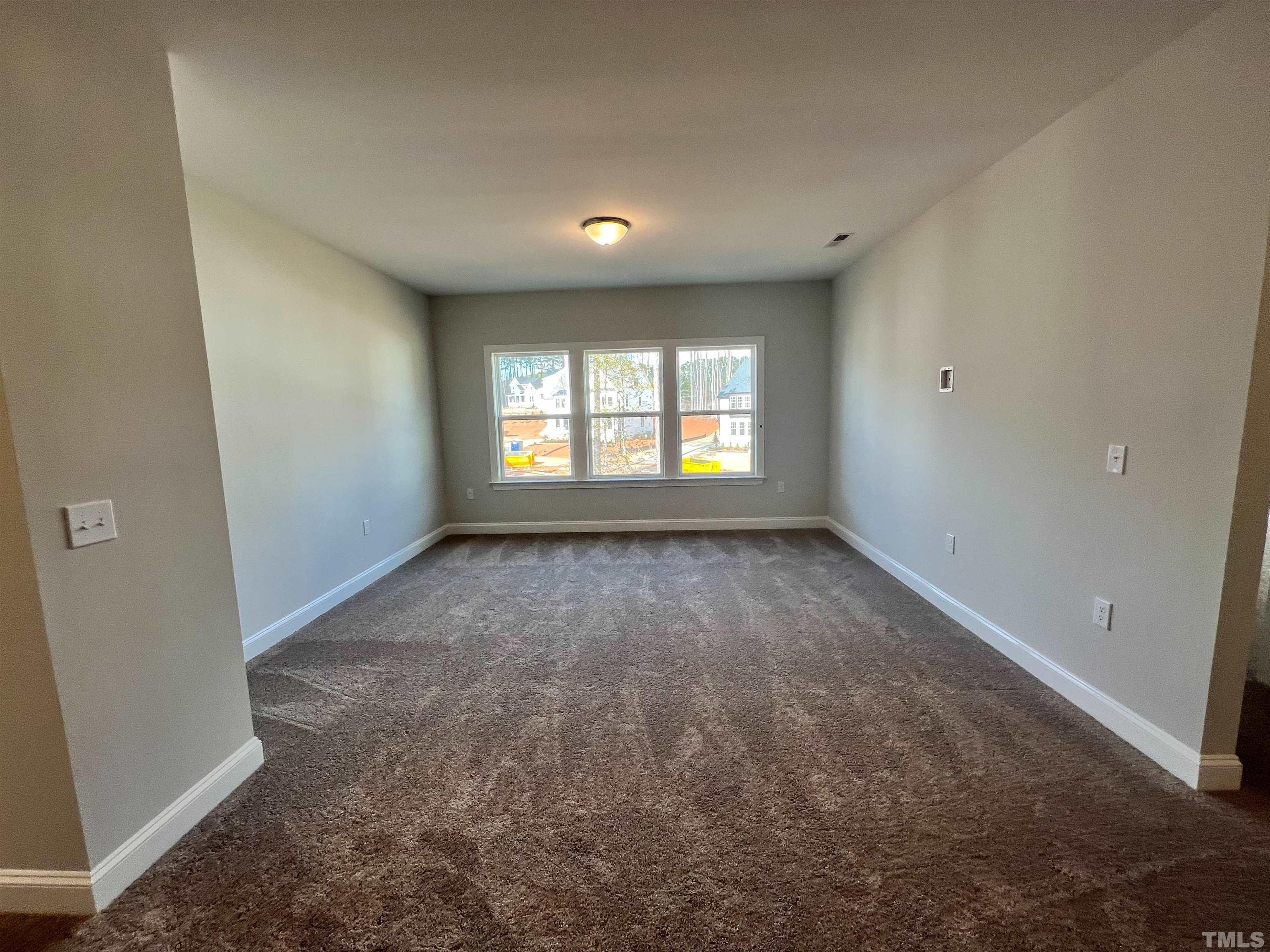7613 Hasentree Way Wake Forest, NC 27587 - Photo 19 of 39 a view of an empty room with a window