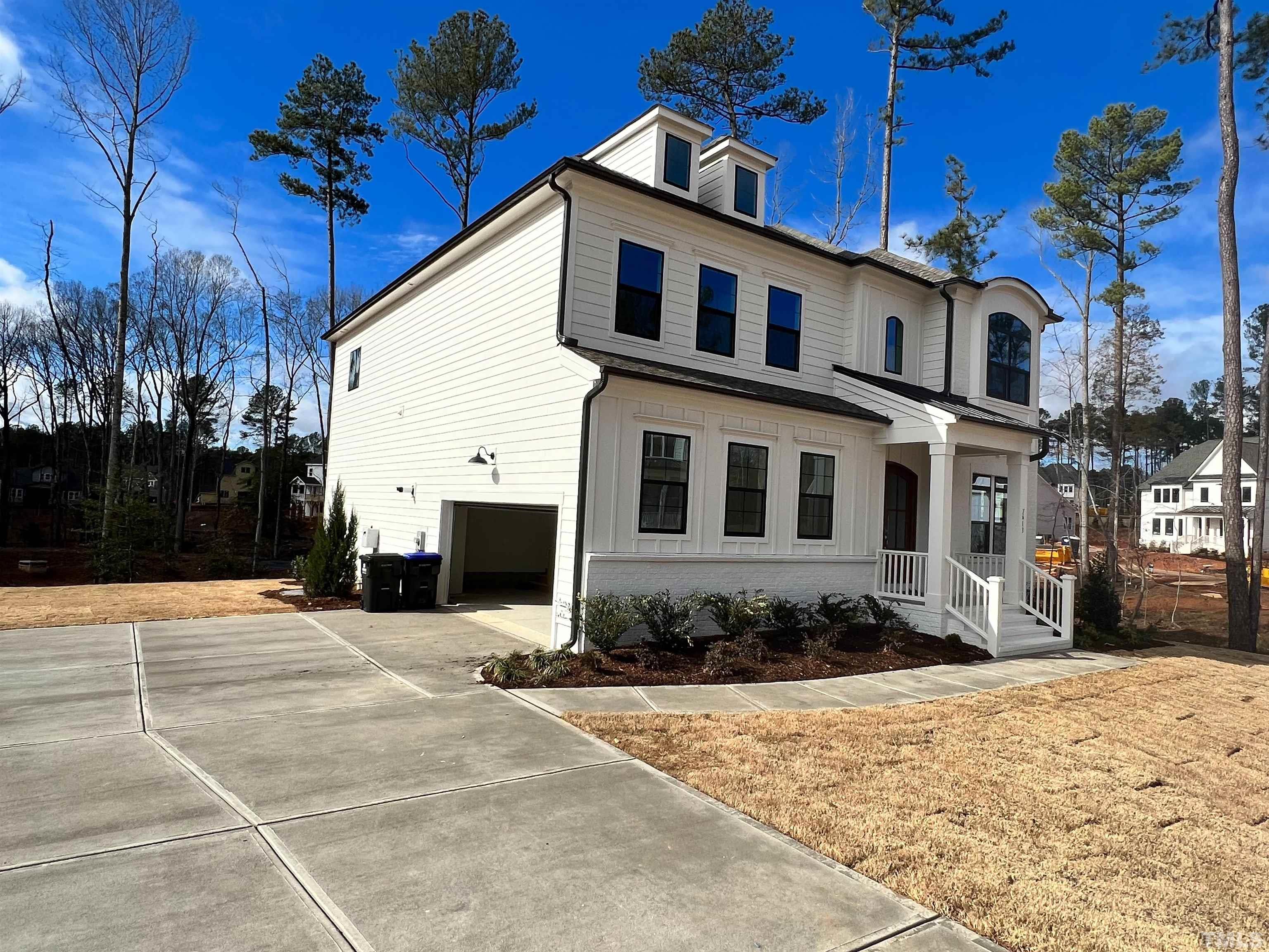 7613 Hasentree Way Wake Forest, NC 27587 - Photo 2 of 39 a front view of a house with a yard