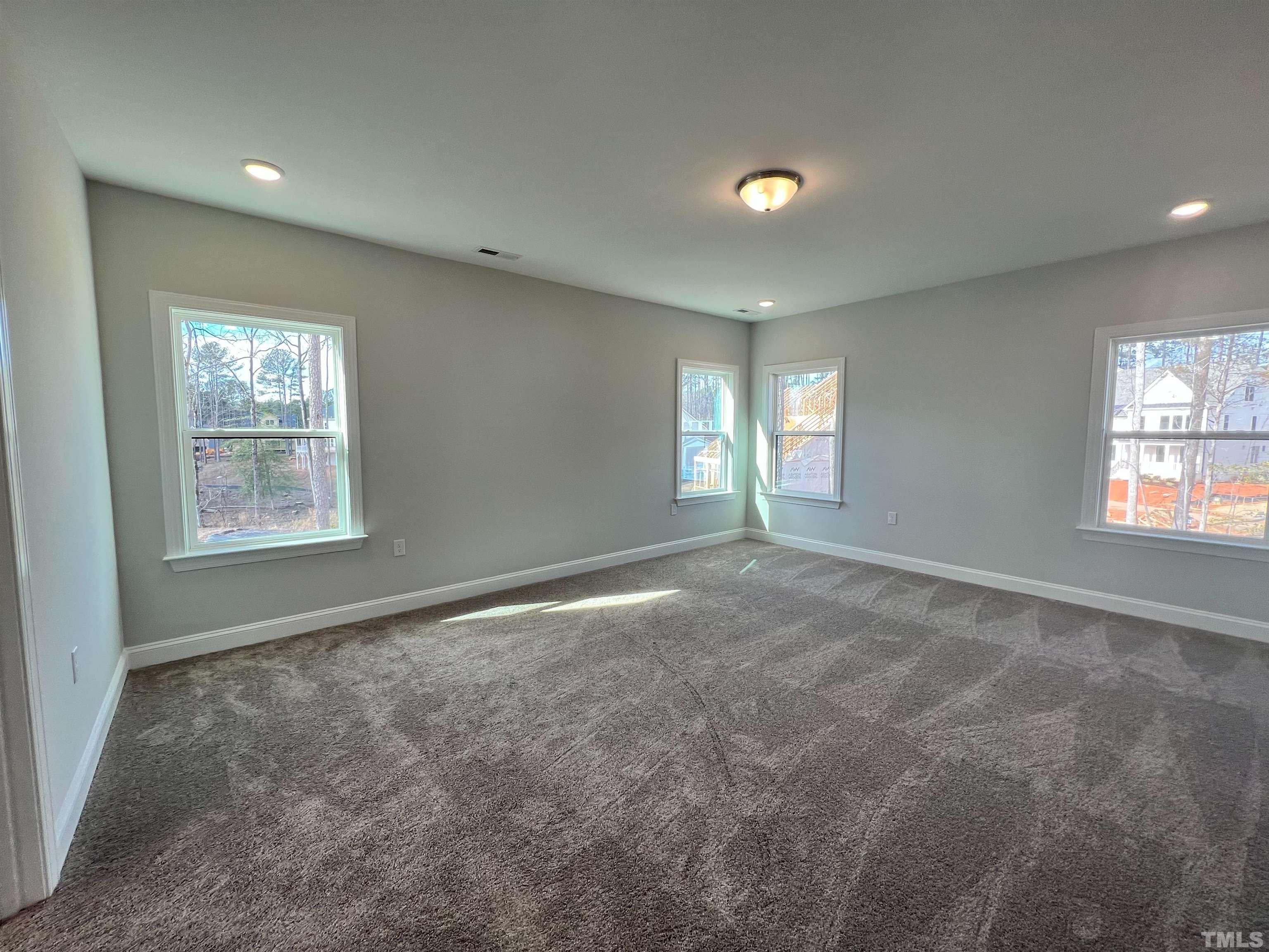 7613 Hasentree Way Wake Forest, NC 27587 - Photo 21 of 39 a view of empty room with windows