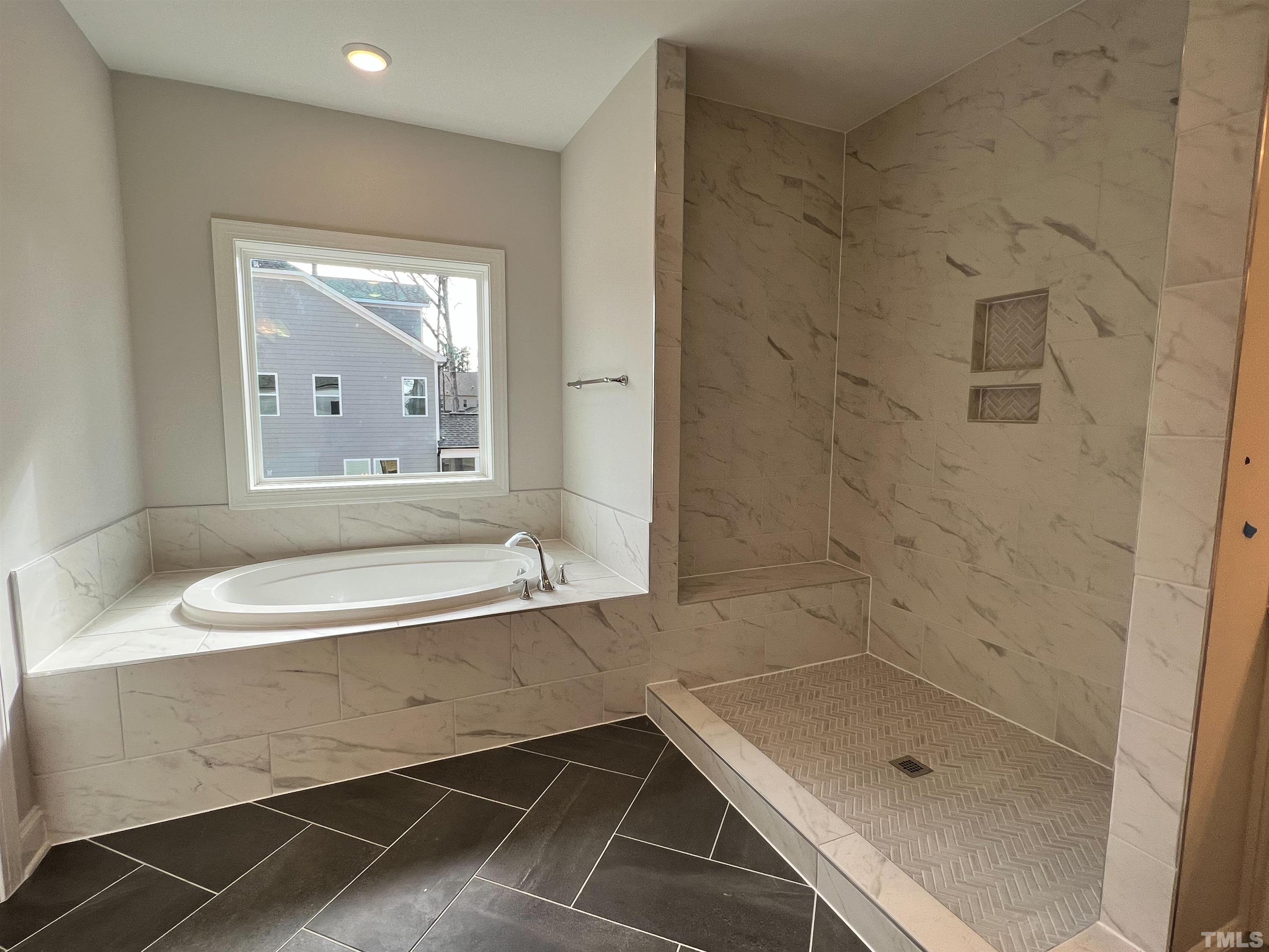 7613 Hasentree Way Wake Forest, NC 27587 - Photo 25 of 39 a bathroom with a sink and a bathtub