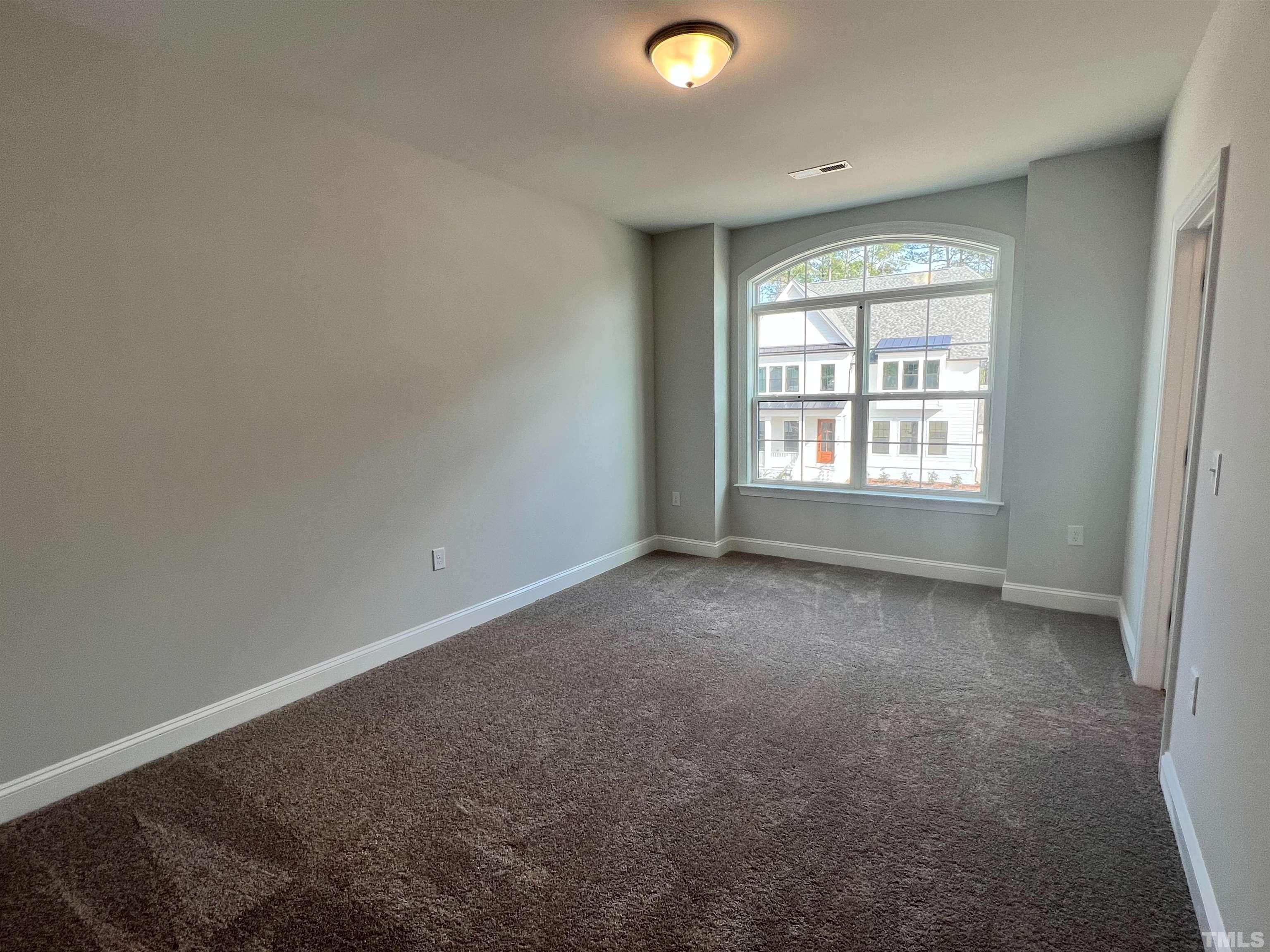 7613 Hasentree Way Wake Forest, NC 27587 - Photo 30 of 39 an empty room with a window
