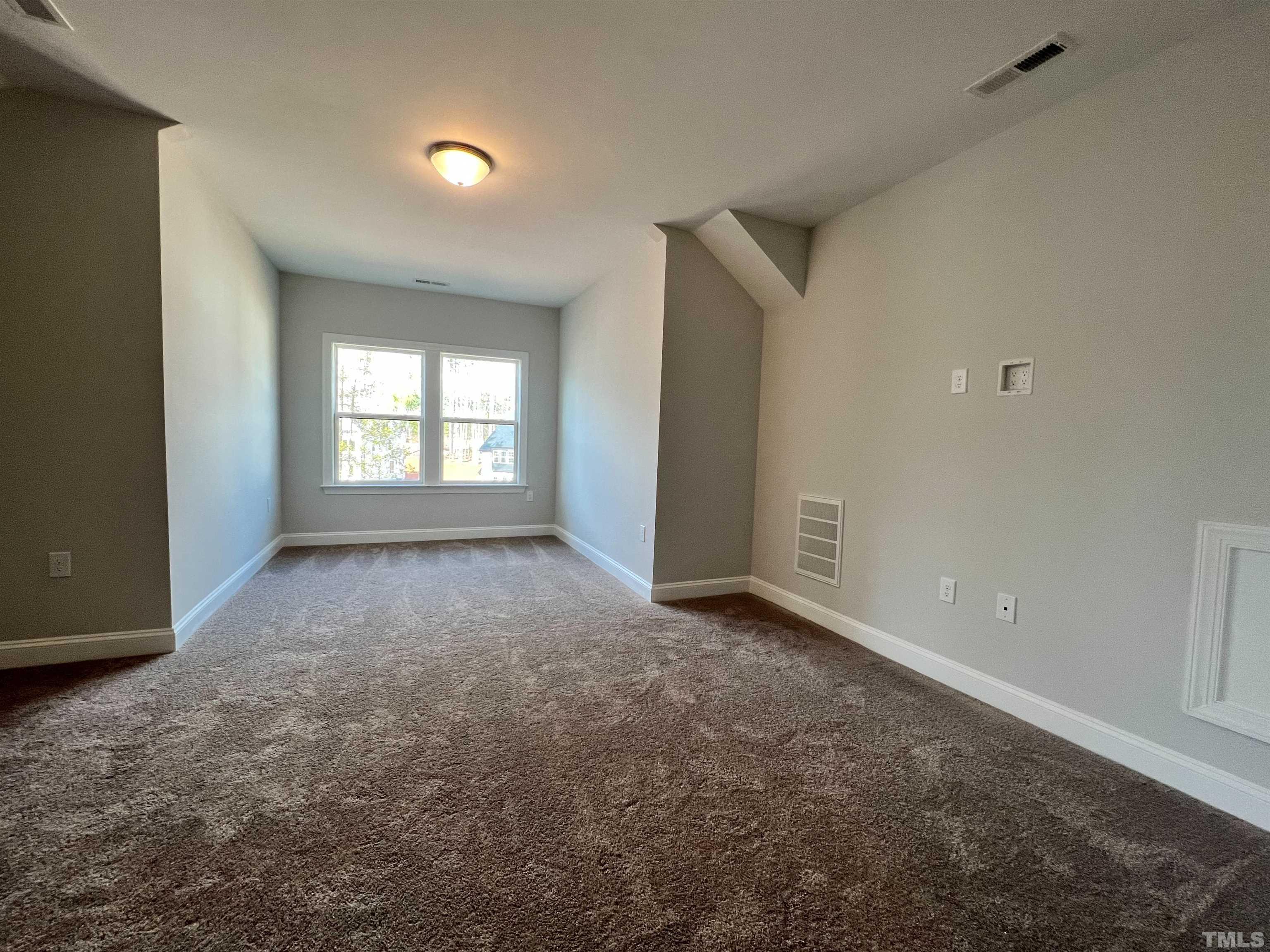 7613 Hasentree Way Wake Forest, NC 27587 - Photo 35 of 39 an empty room with windows and closet