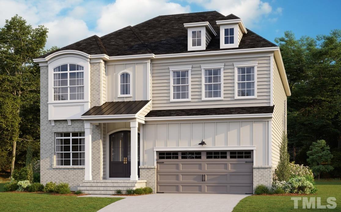 7613 Hasentree Way Wake Forest, NC 27587 - Photo 39 of 39 a front view of a house with garden and garage