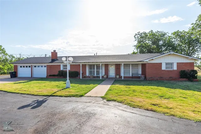 a view of a house with a swimming pool