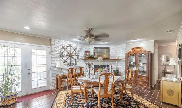 a view of a dining room with furniture wooden floor and chandelier