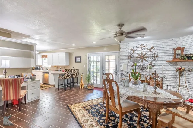 a view of a a dining room with furniture window and outside view